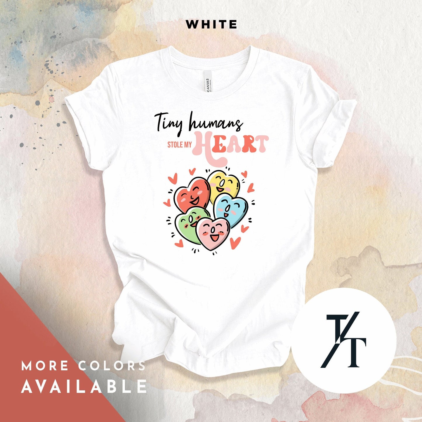 a shirt that says "tiny humans stole my heart"with a collage of candy hearts with cute faces on them