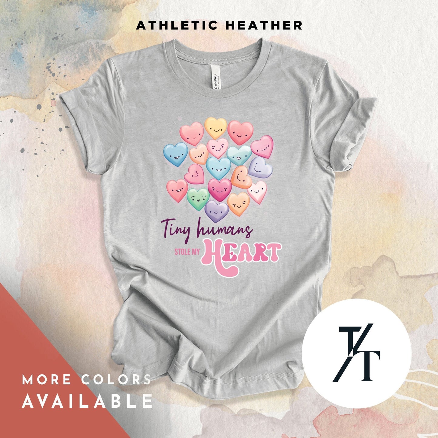 a shirt that says "tiny humans stole my heart"with a collage of candy hearts with cute faces on them