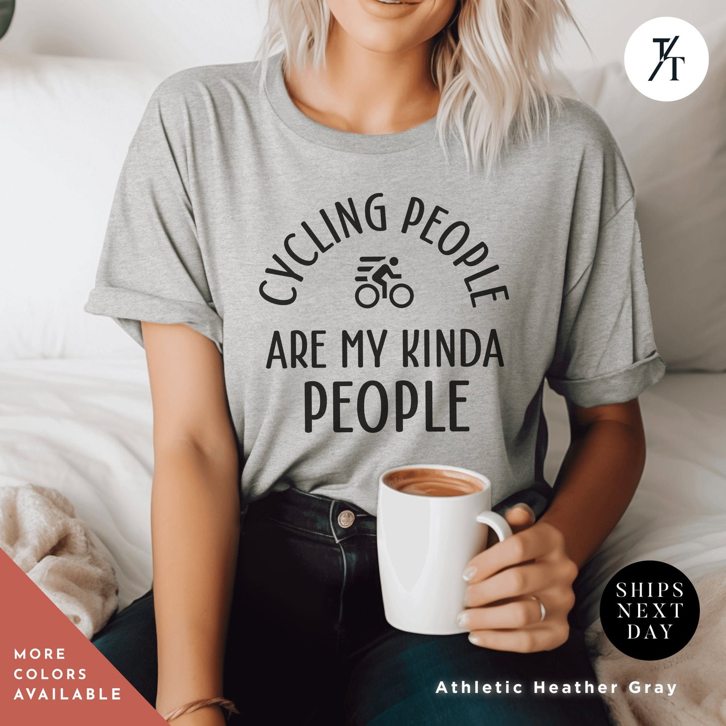 a woman sitting on a bed holding a cup of coffee