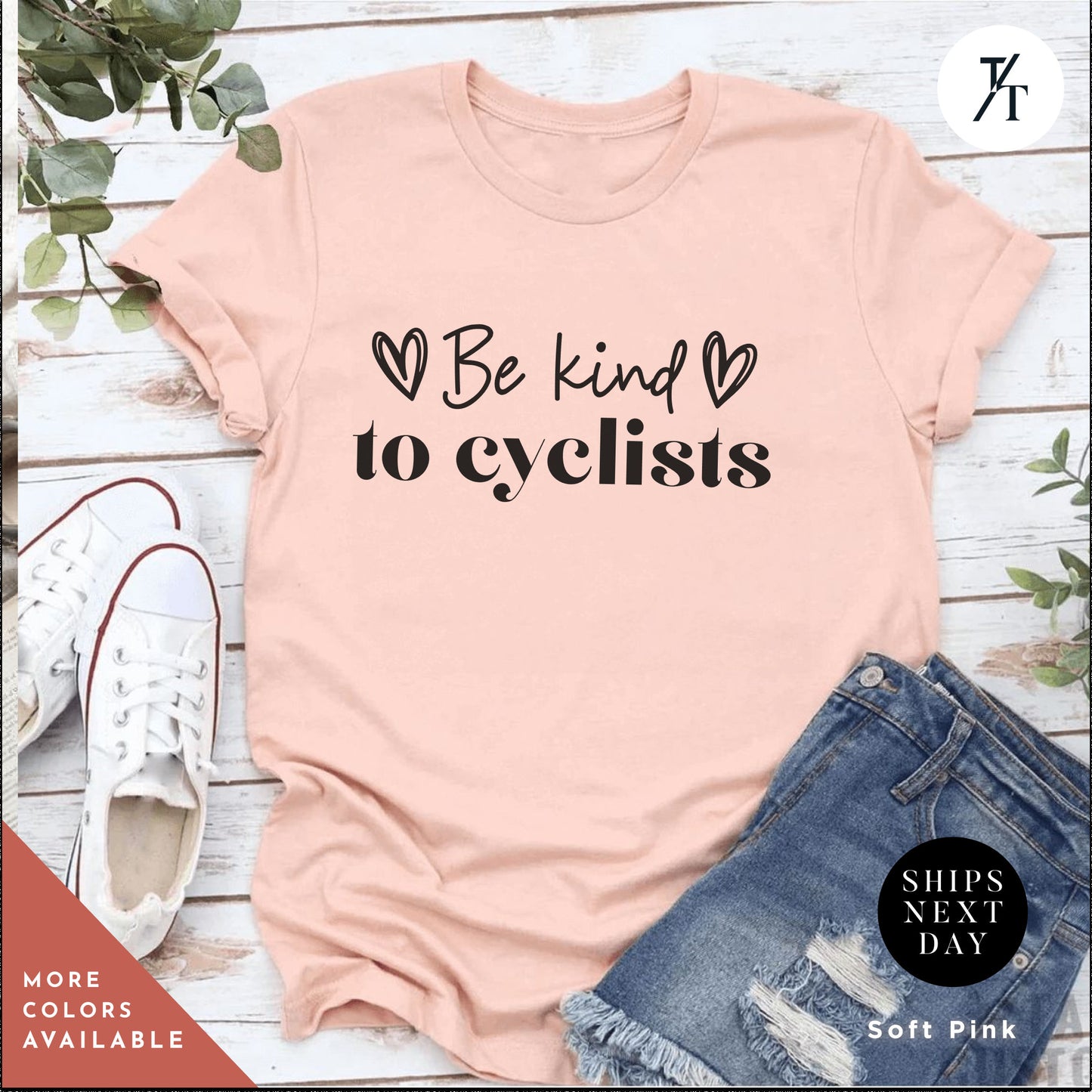 a pink shirt that says be kind to cyclists