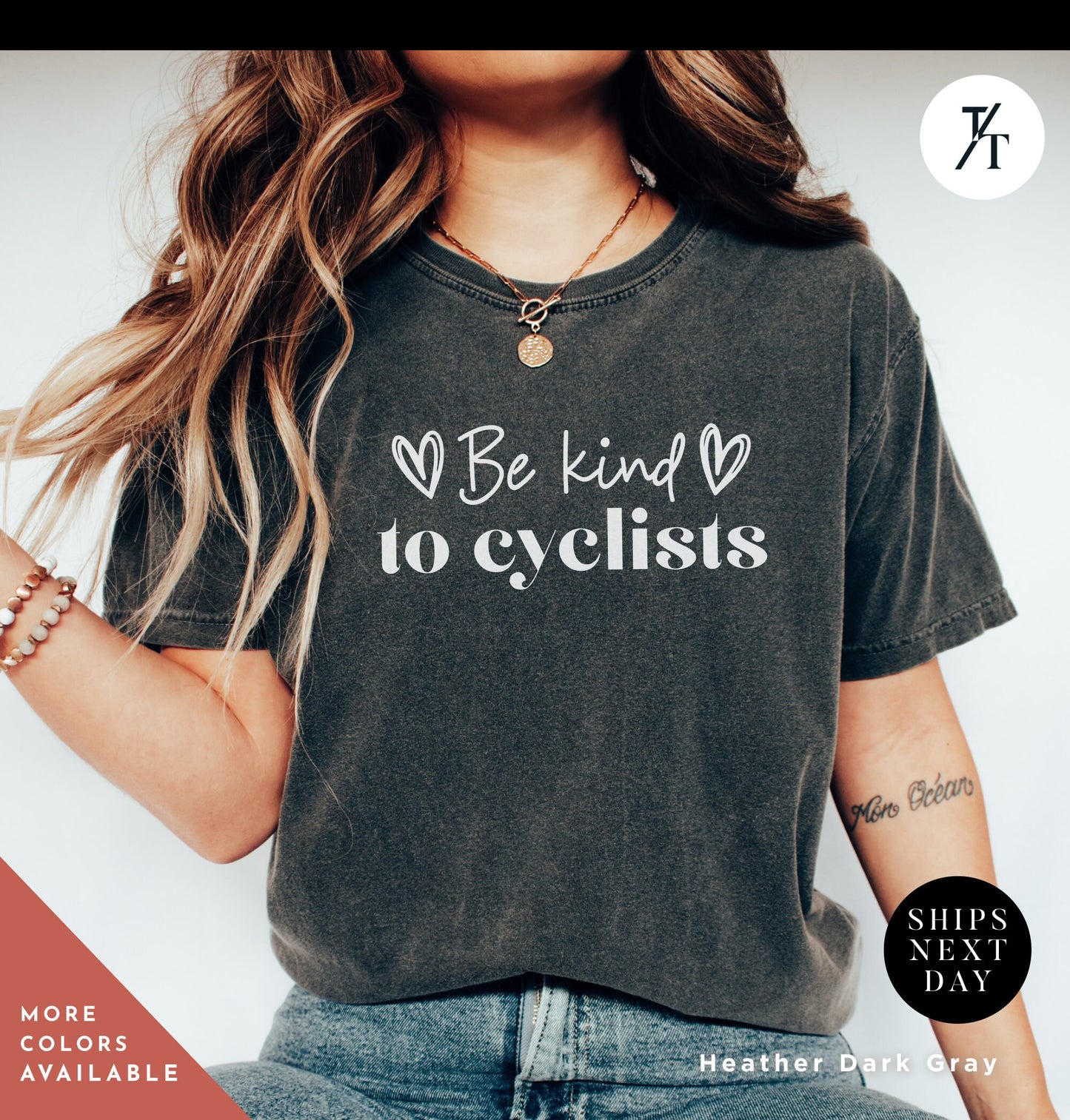 a woman wearing a t - shirt that says be kind to cyclists