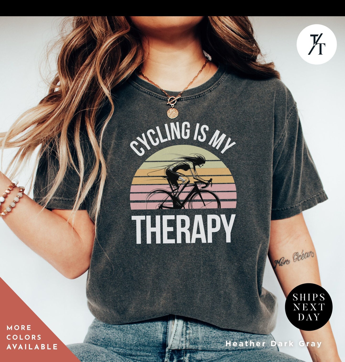 a woman wearing a shirt that says cycling is my therapy