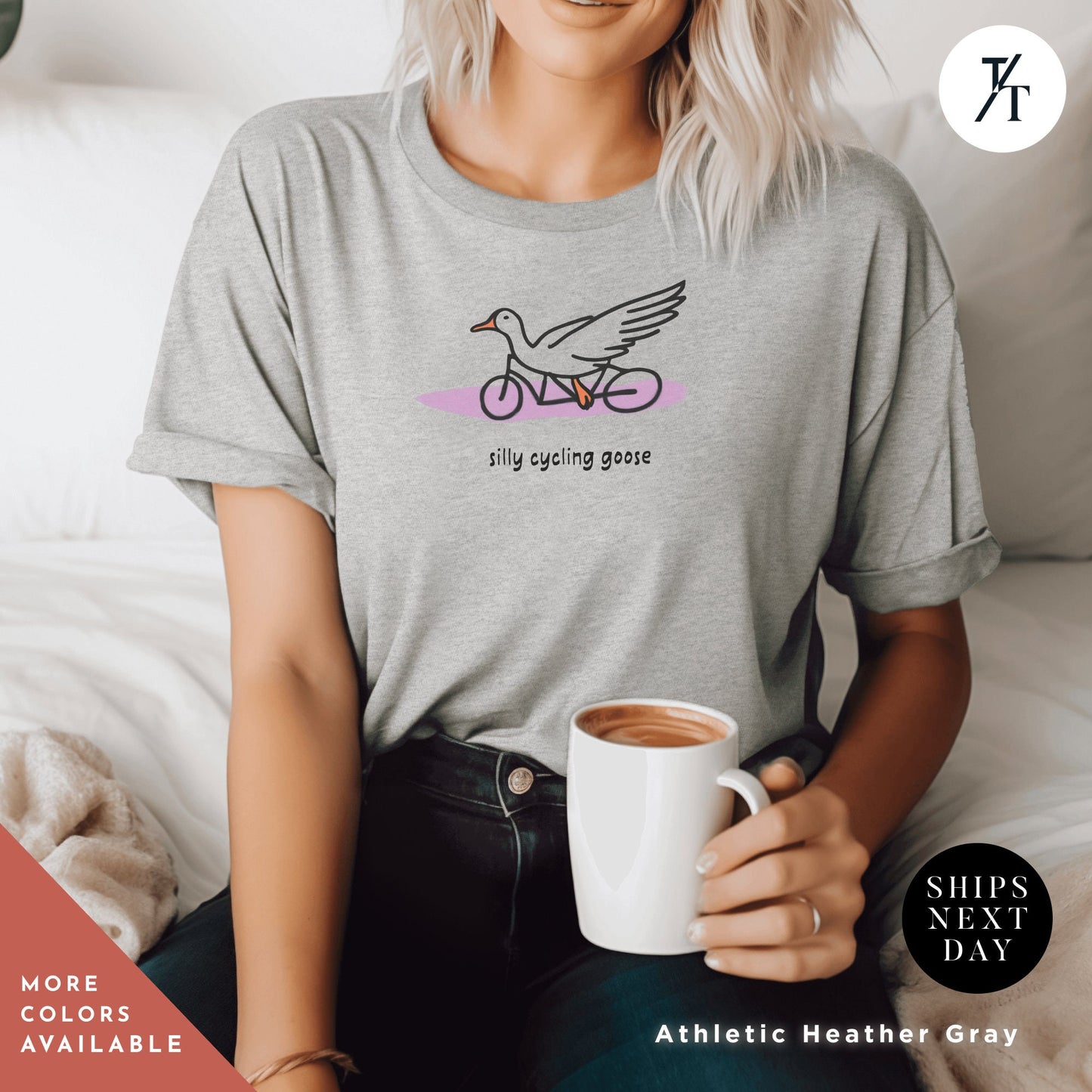a woman sitting on a bed holding a cup of coffee