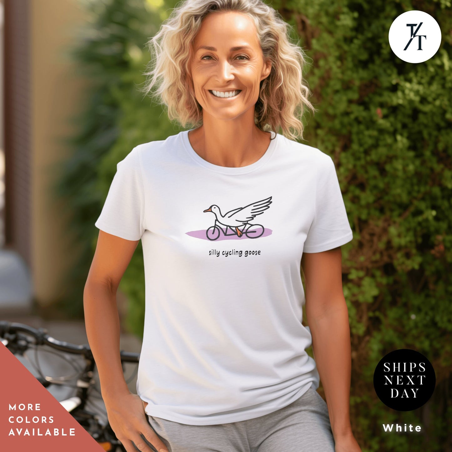 a woman wearing a white shirt with a bird on it