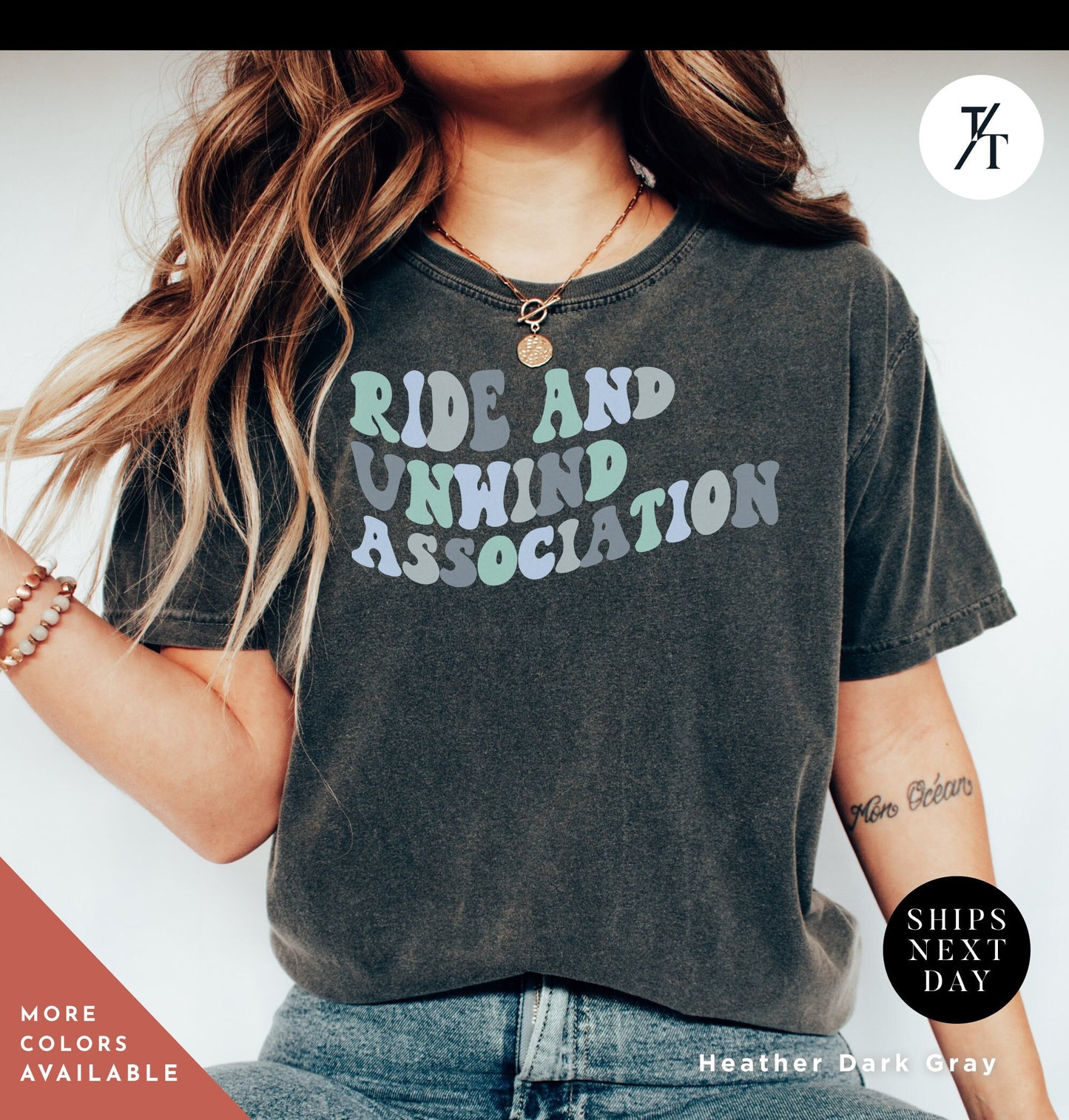 a woman with long hair wearing a shirt that says ride and unwind association