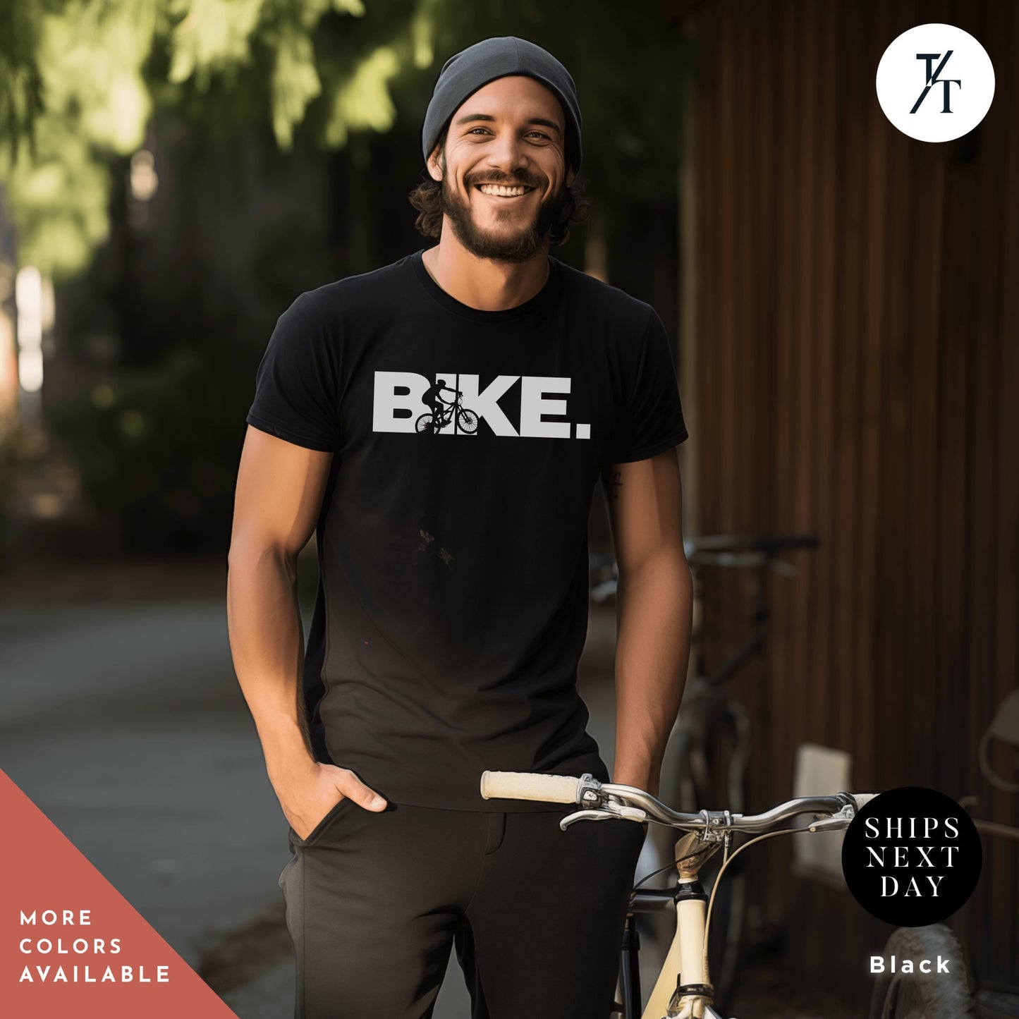 a man standing next to a bike wearing a bike t - shirt