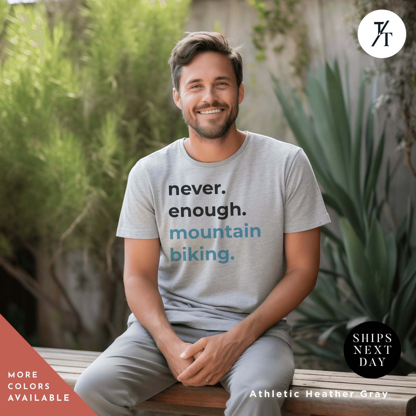 a man sitting on a bench wearing a shirt that says never enough mountain biking