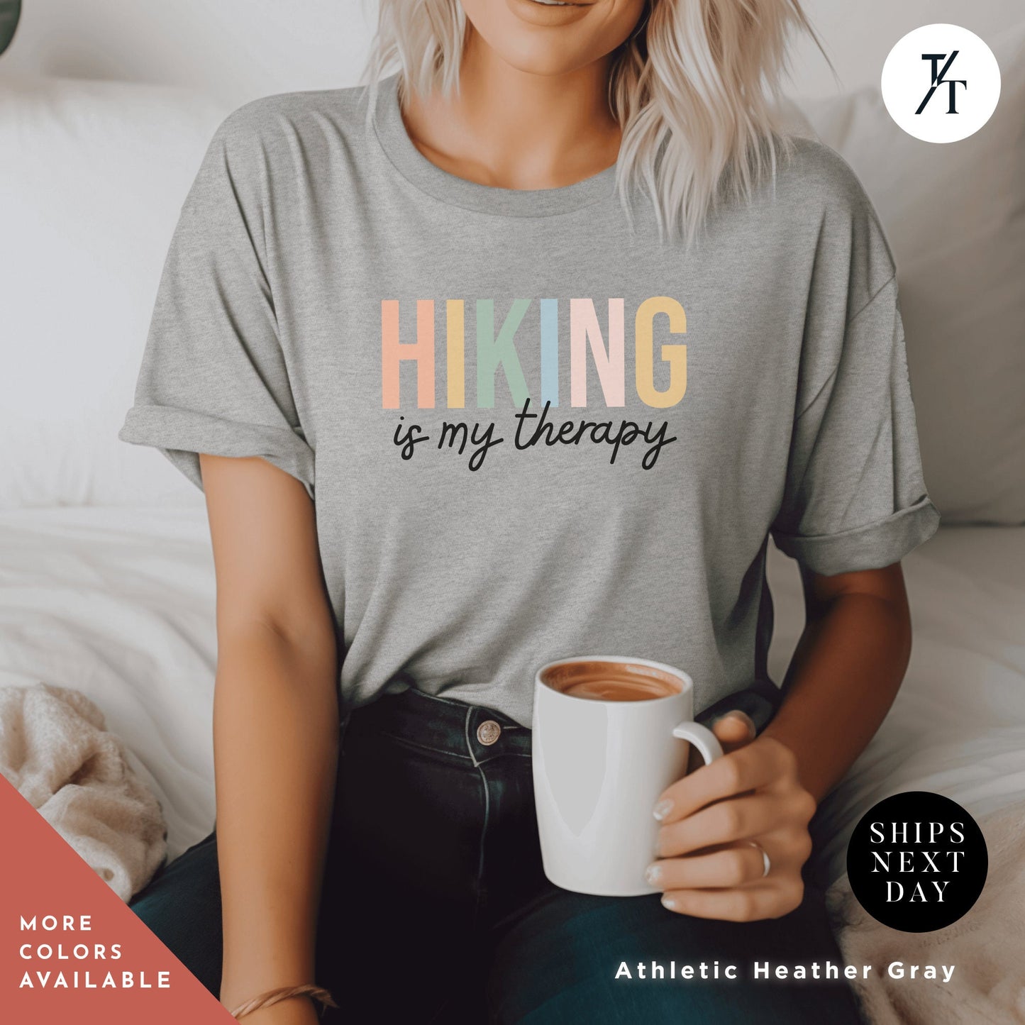 a woman sitting on a bed holding a cup of coffee