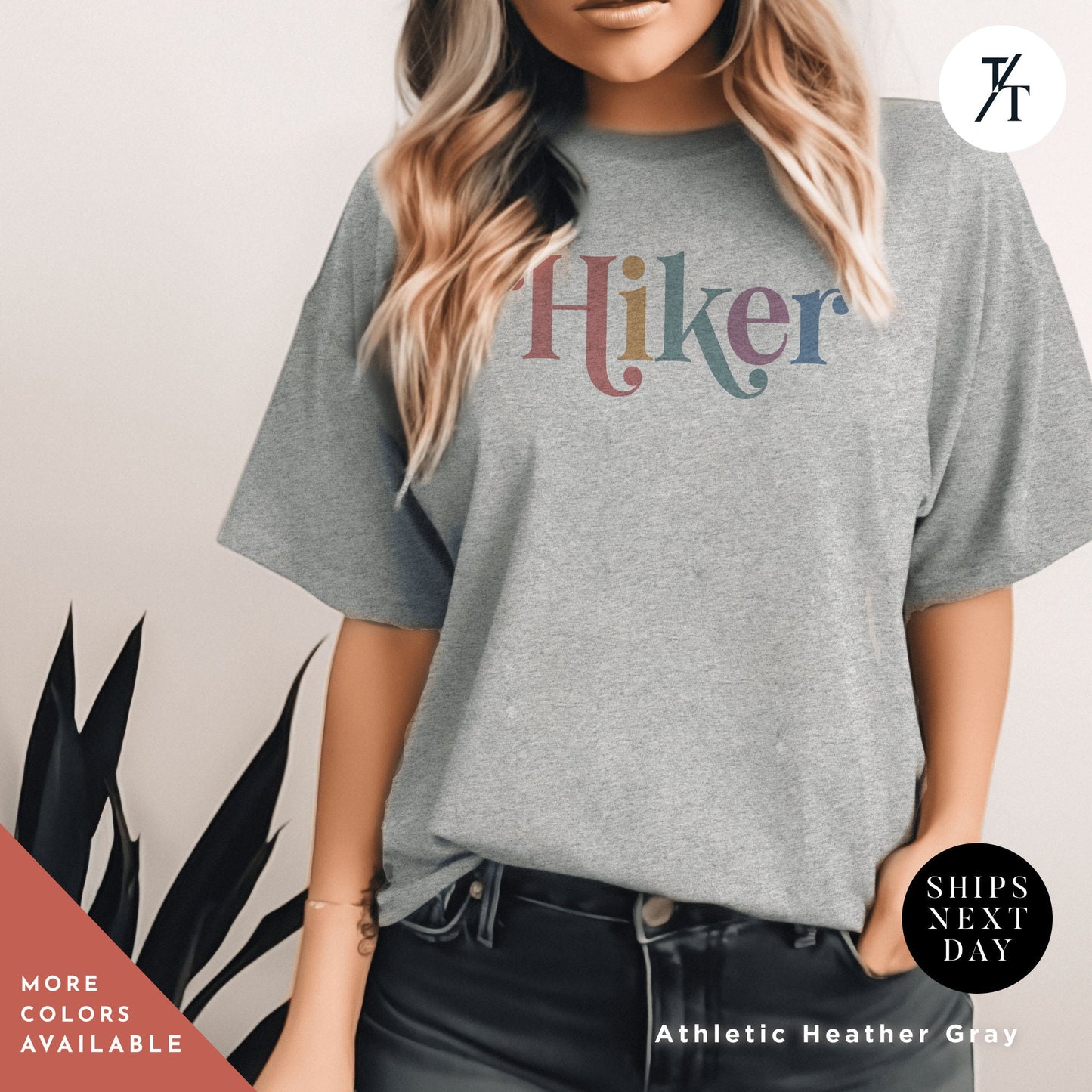 a woman wearing a t - shirt with the word hiker on it