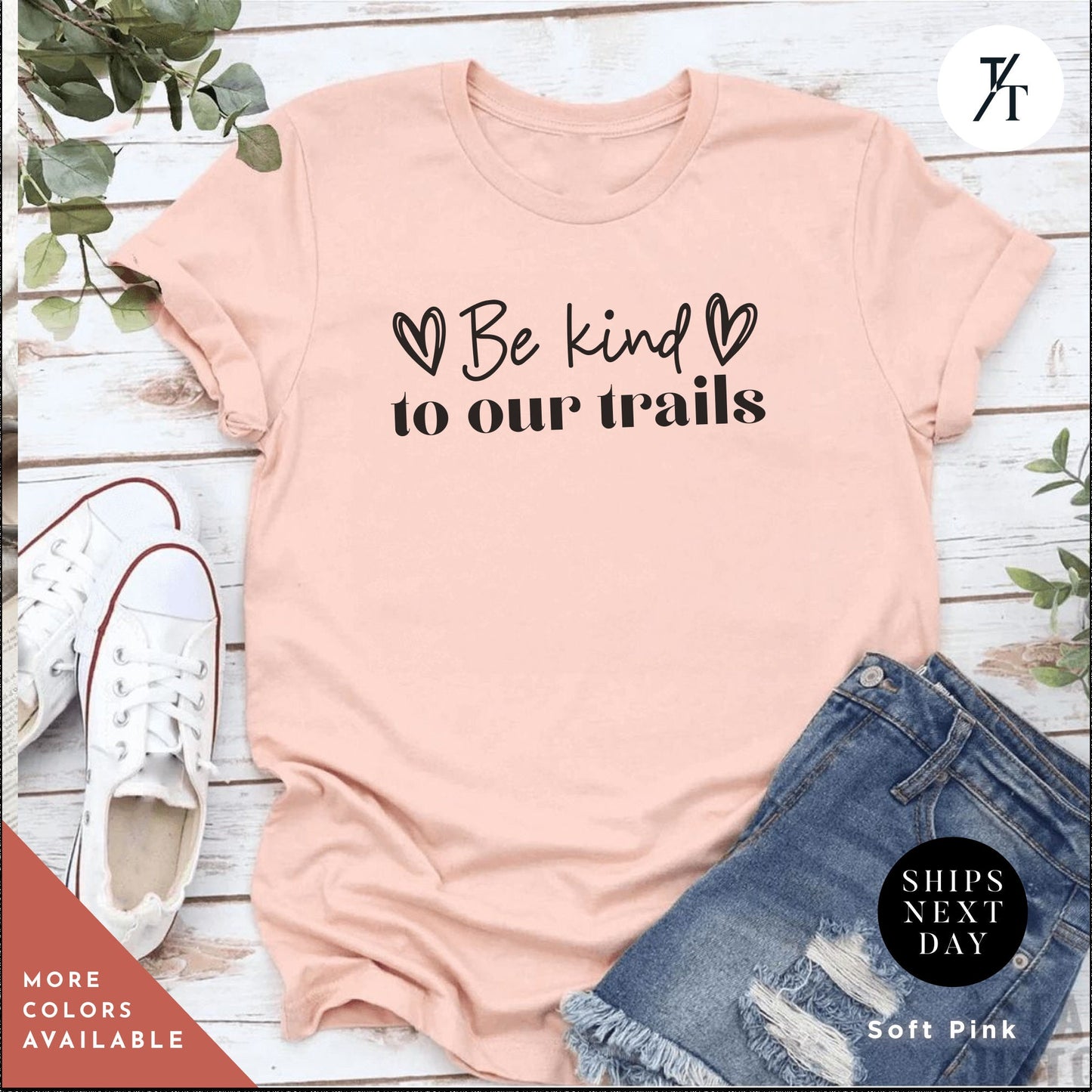 a pink shirt that says be kind to our trails