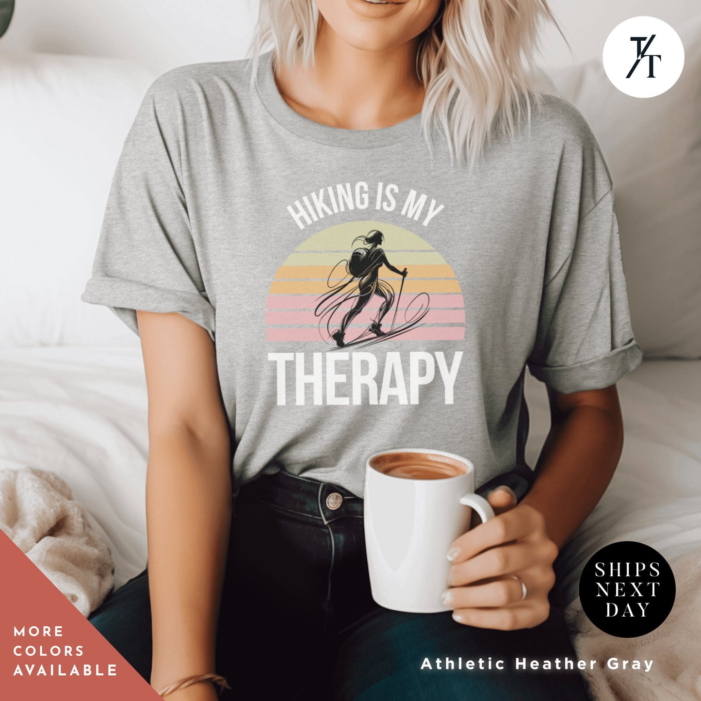 a woman sitting on a bed holding a cup of coffee