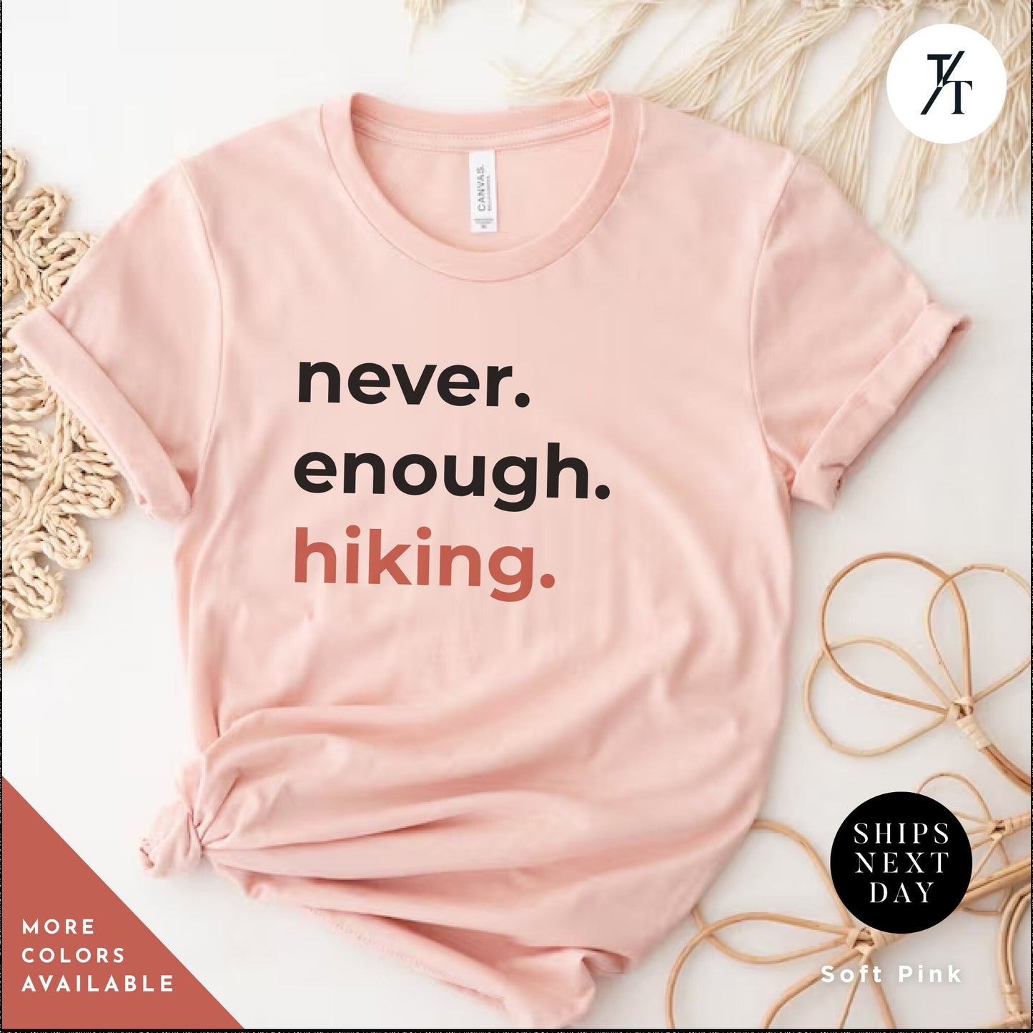 a pink t - shirt that says never enough hiking