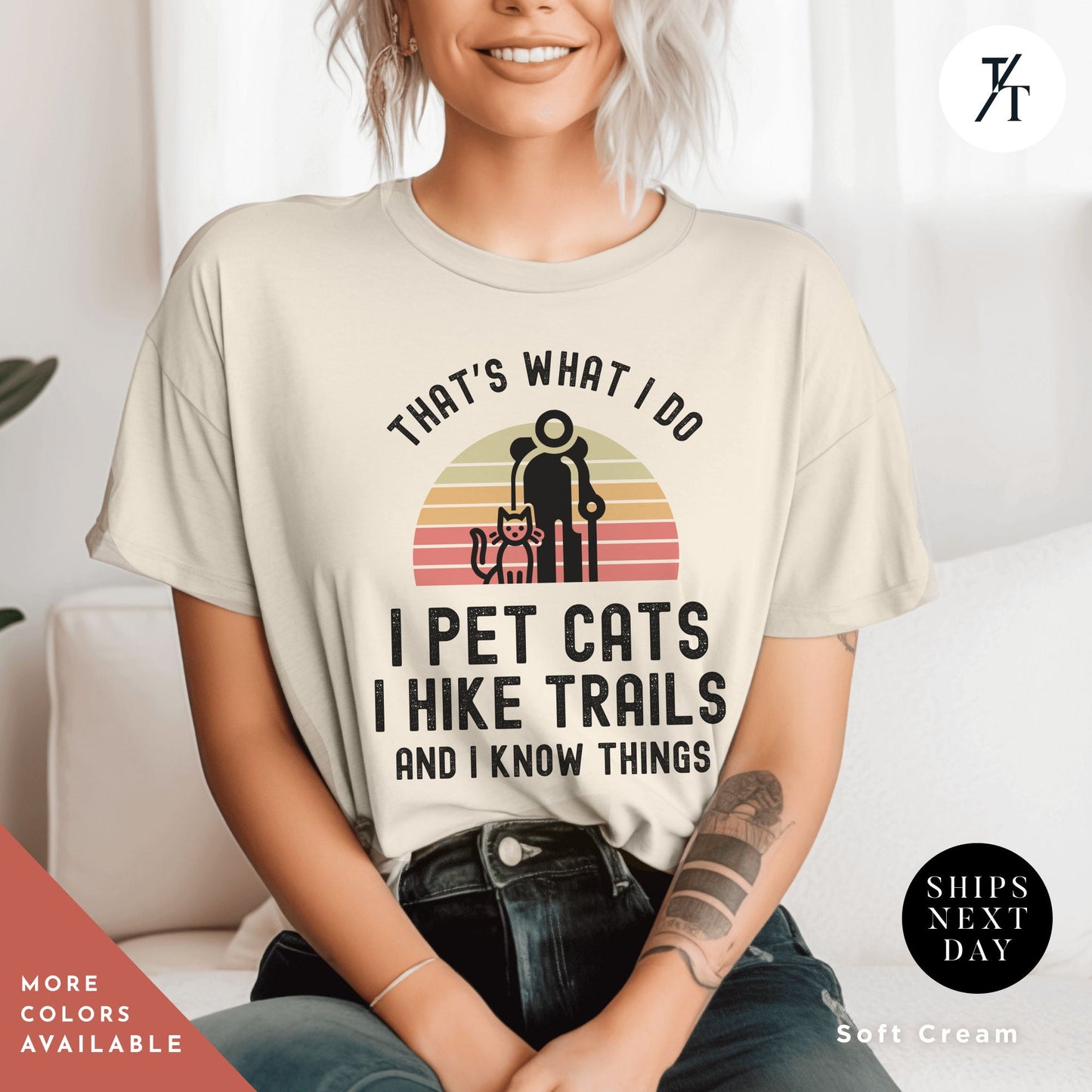 a woman sitting on a couch wearing a t - shirt