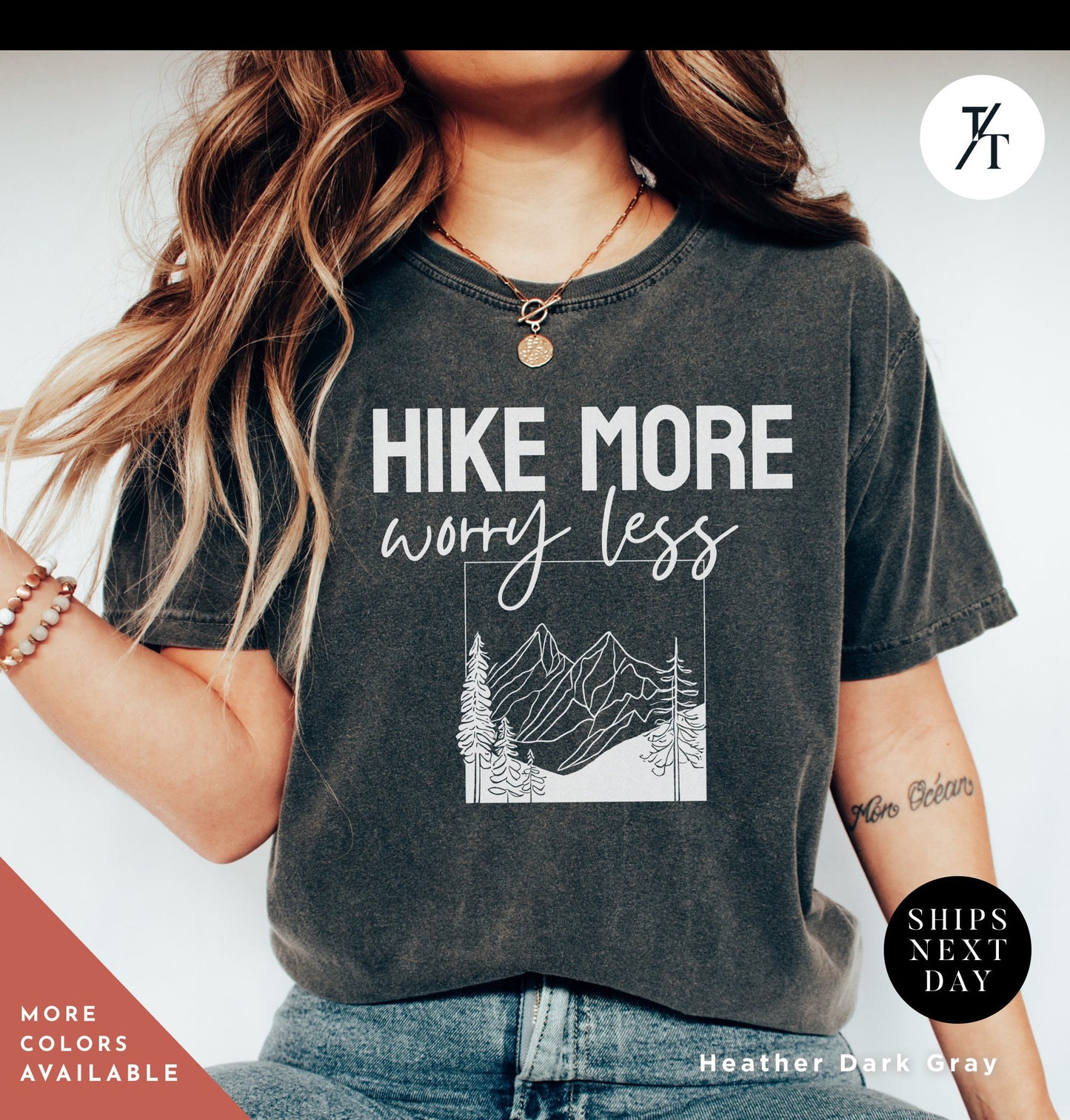 a woman wearing a shirt that says hike more worry less