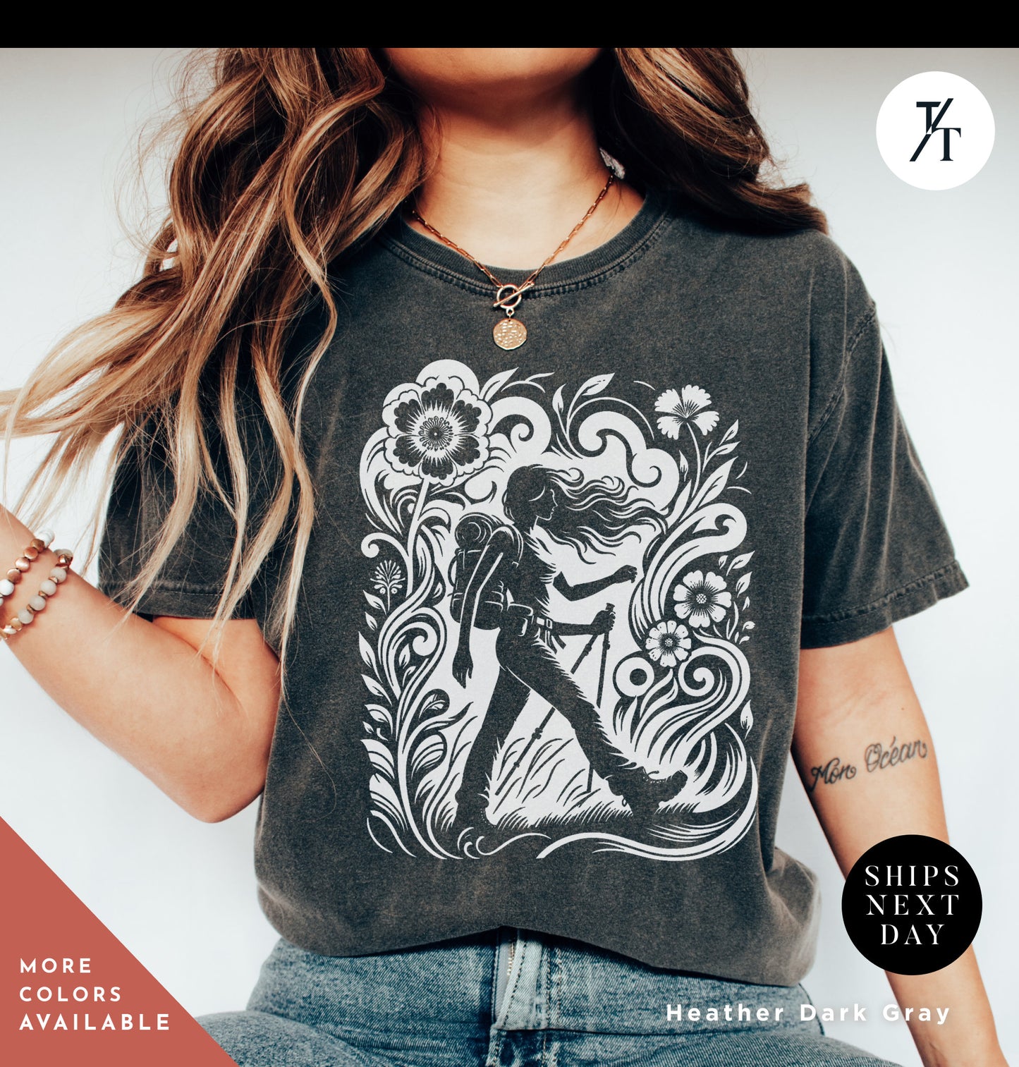 a woman wearing a t - shirt with a picture of a woman holding a guitar
