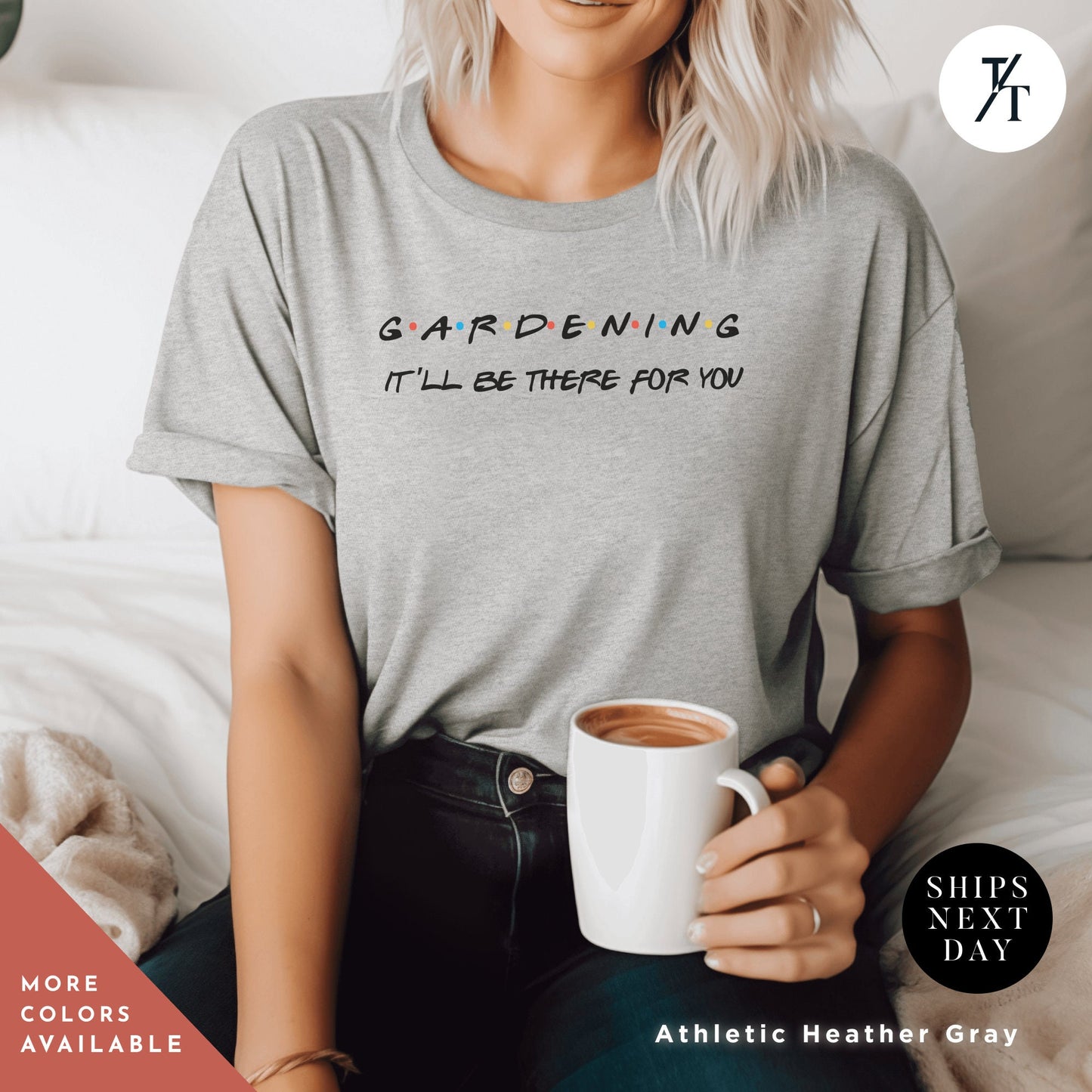 a woman sitting on a bed holding a cup of coffee