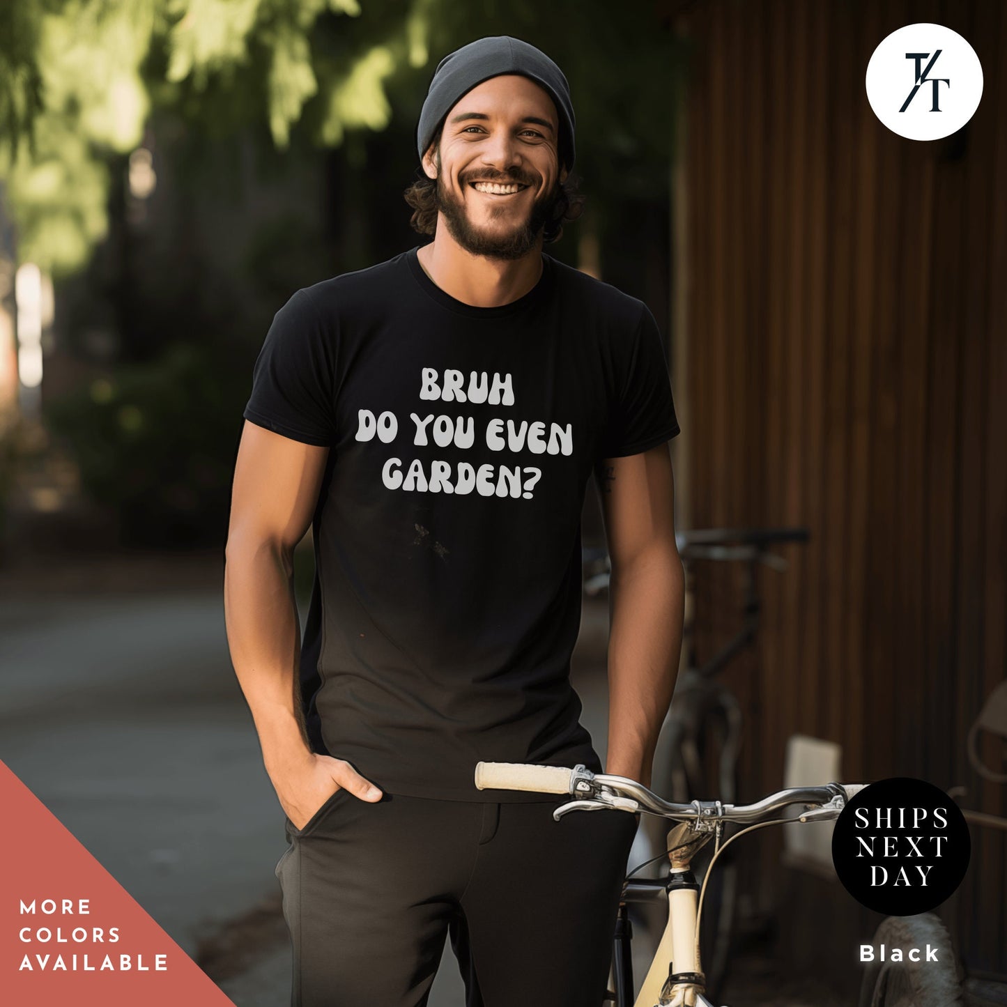 a man standing next to a bike wearing a black shirt