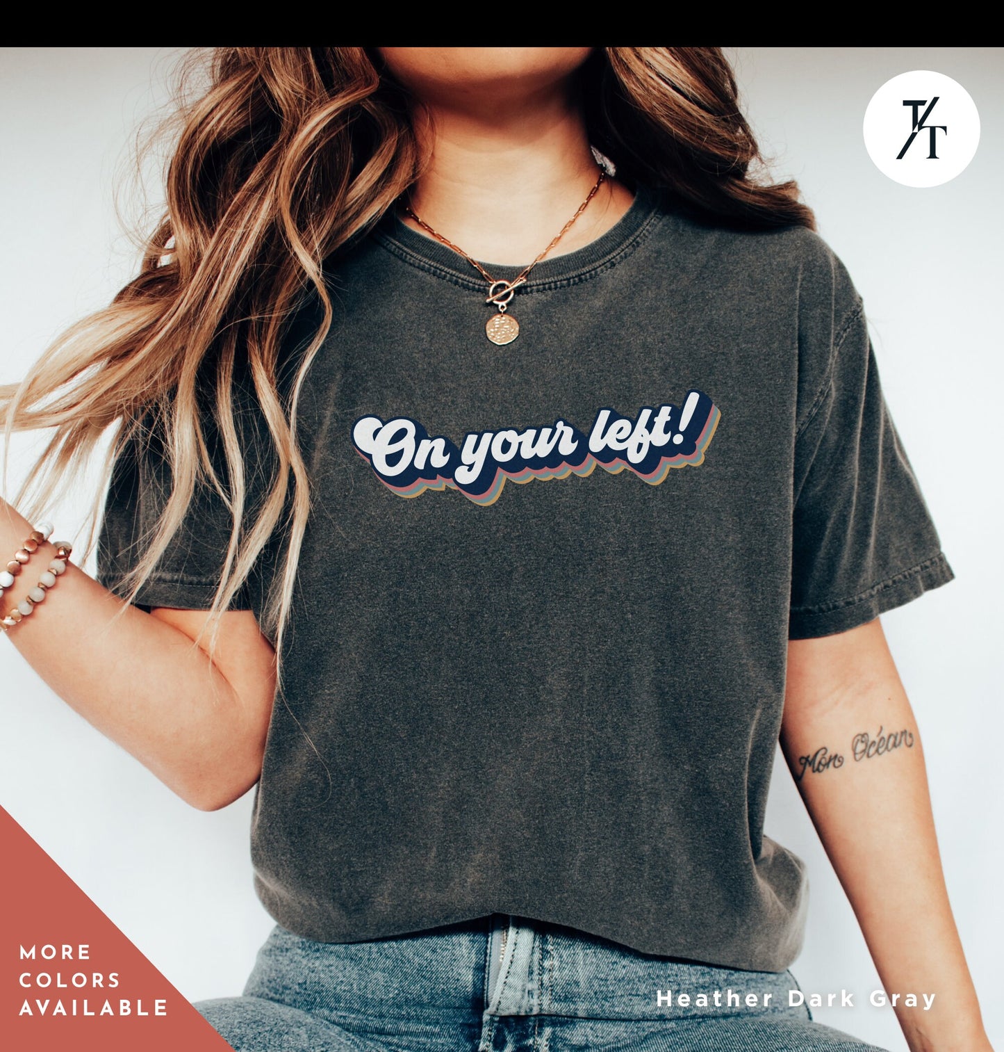 a woman wearing a t - shirt that says on your left