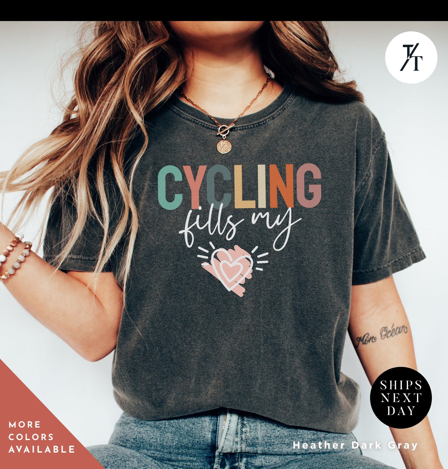 a woman wearing a t - shirt that says cycling flies my heart