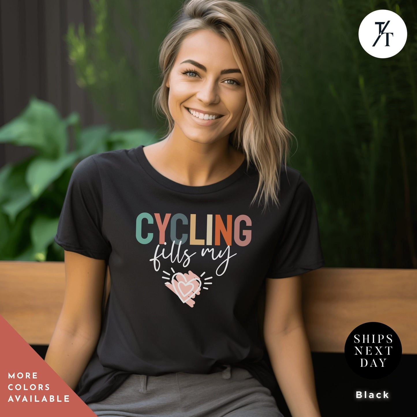a woman sitting on a bench wearing a black cycling shirt
