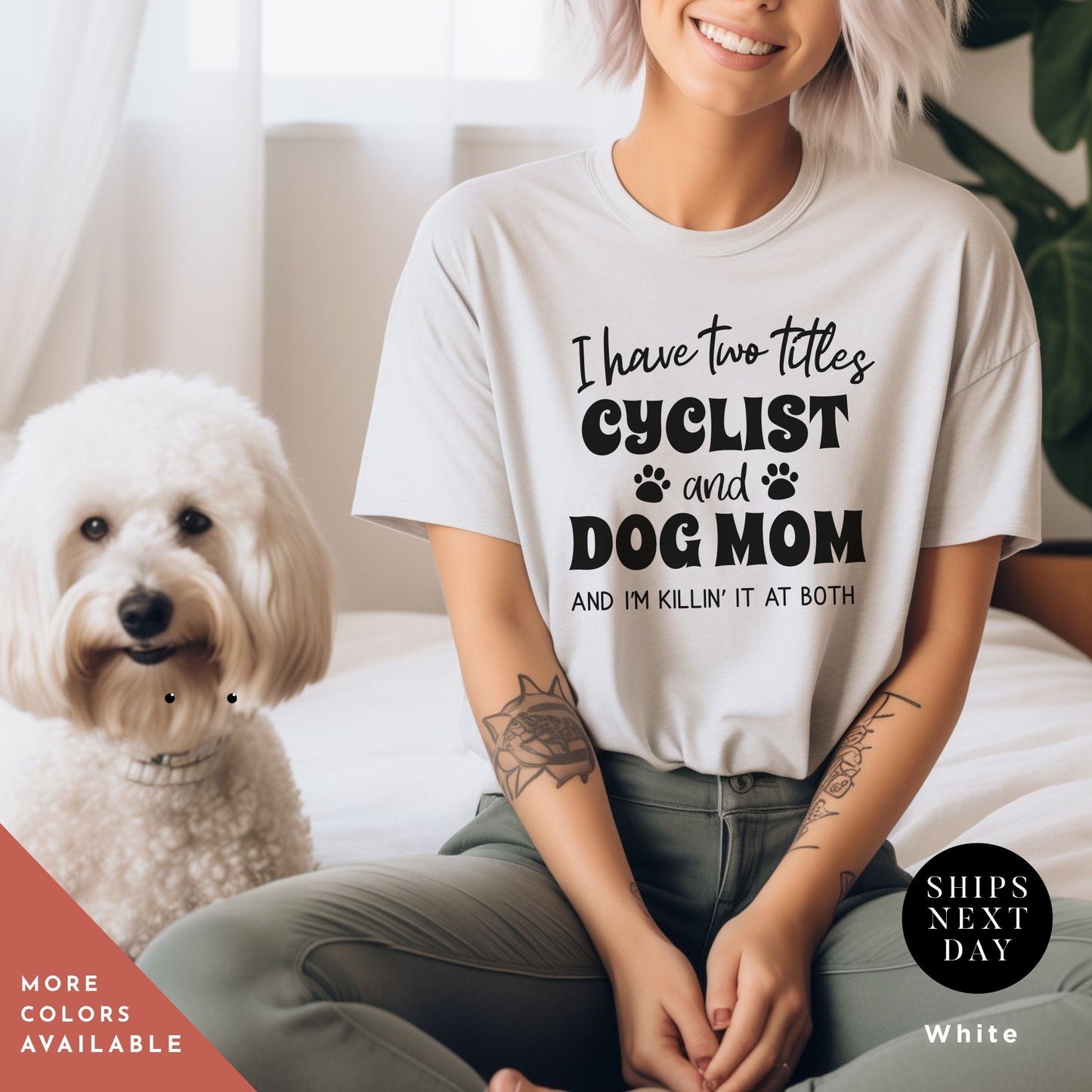 a woman sitting on a bed next to a dog