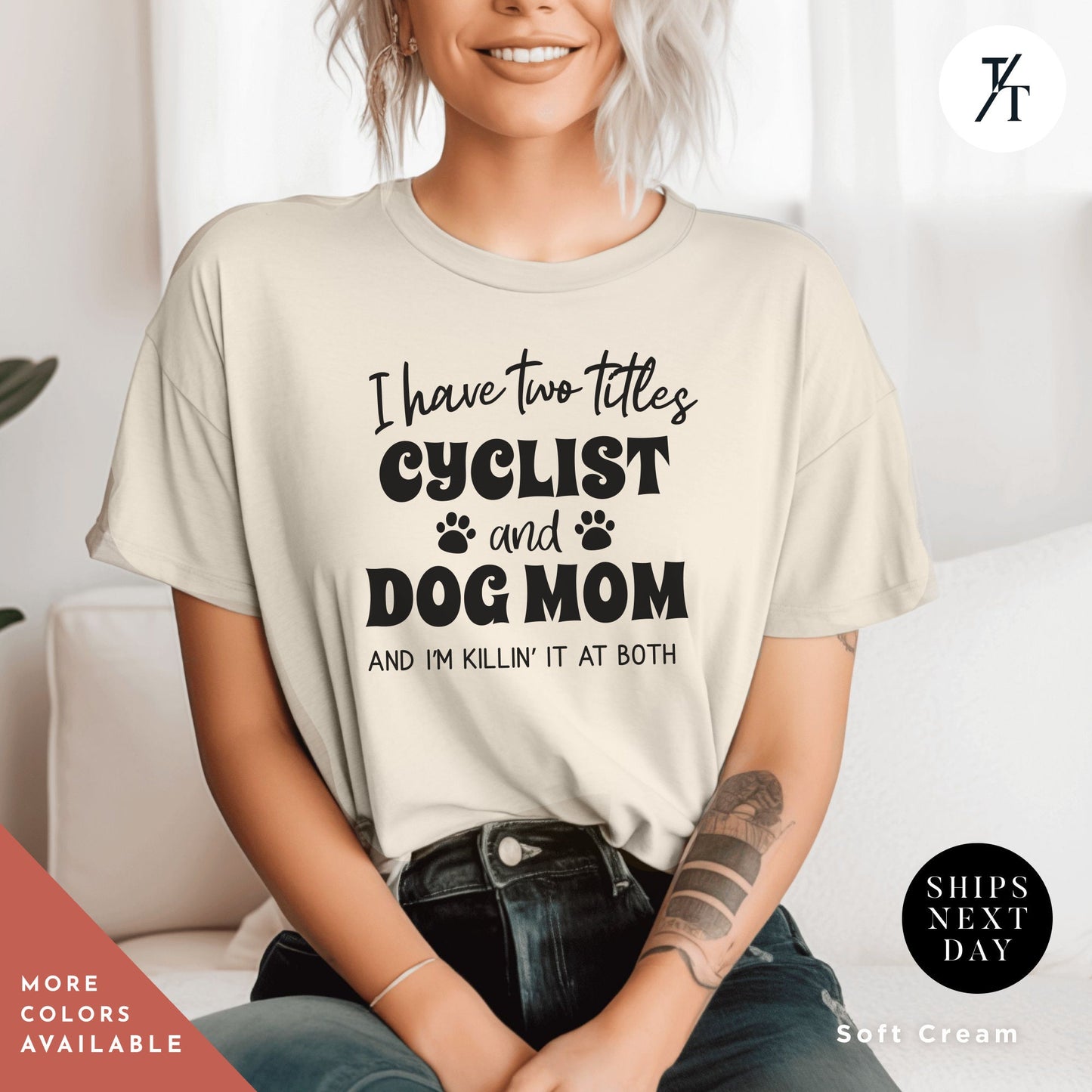 a woman wearing a t - shirt that says i have two titles and a dog