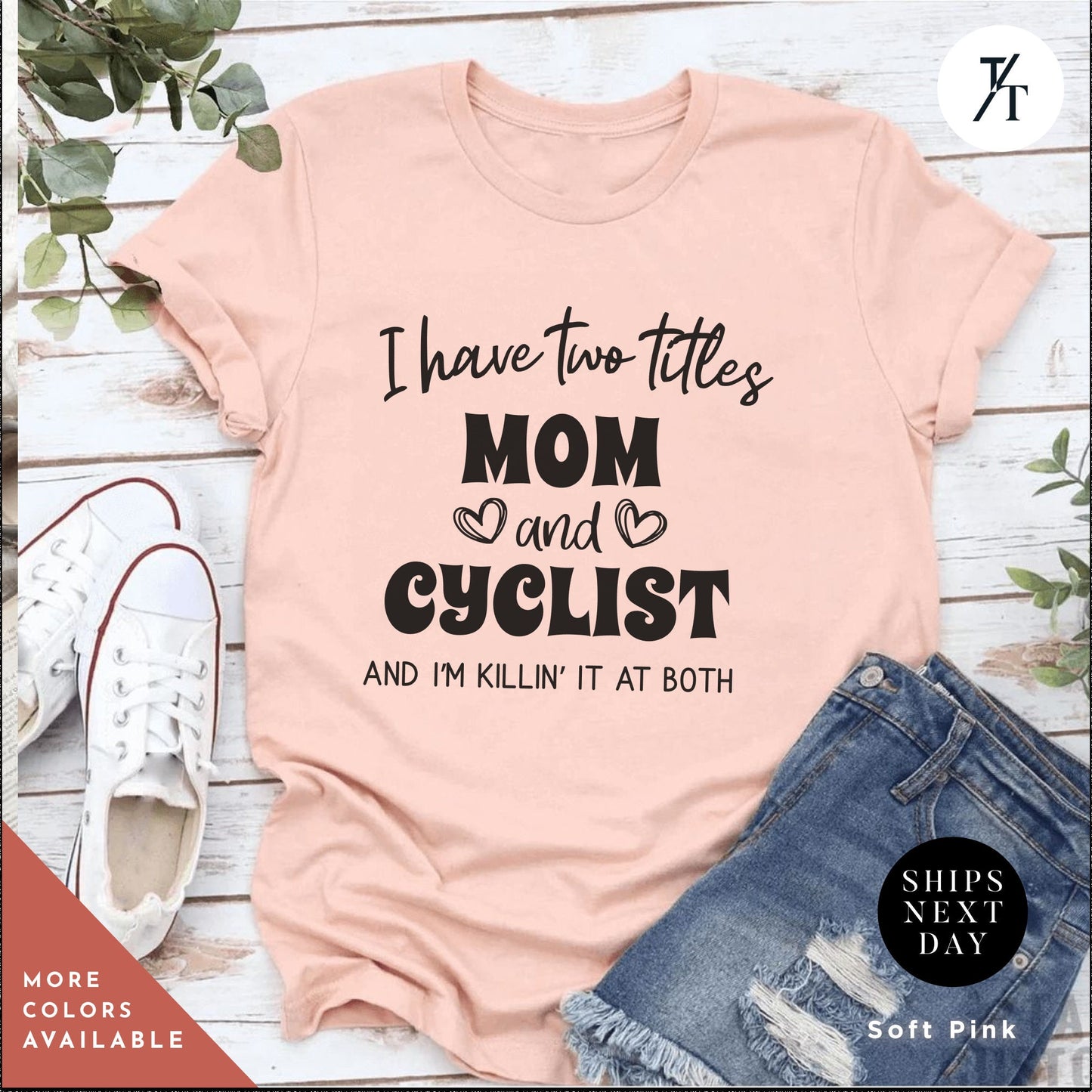 a pink shirt that says i have two titles mom and cyclist and i'm