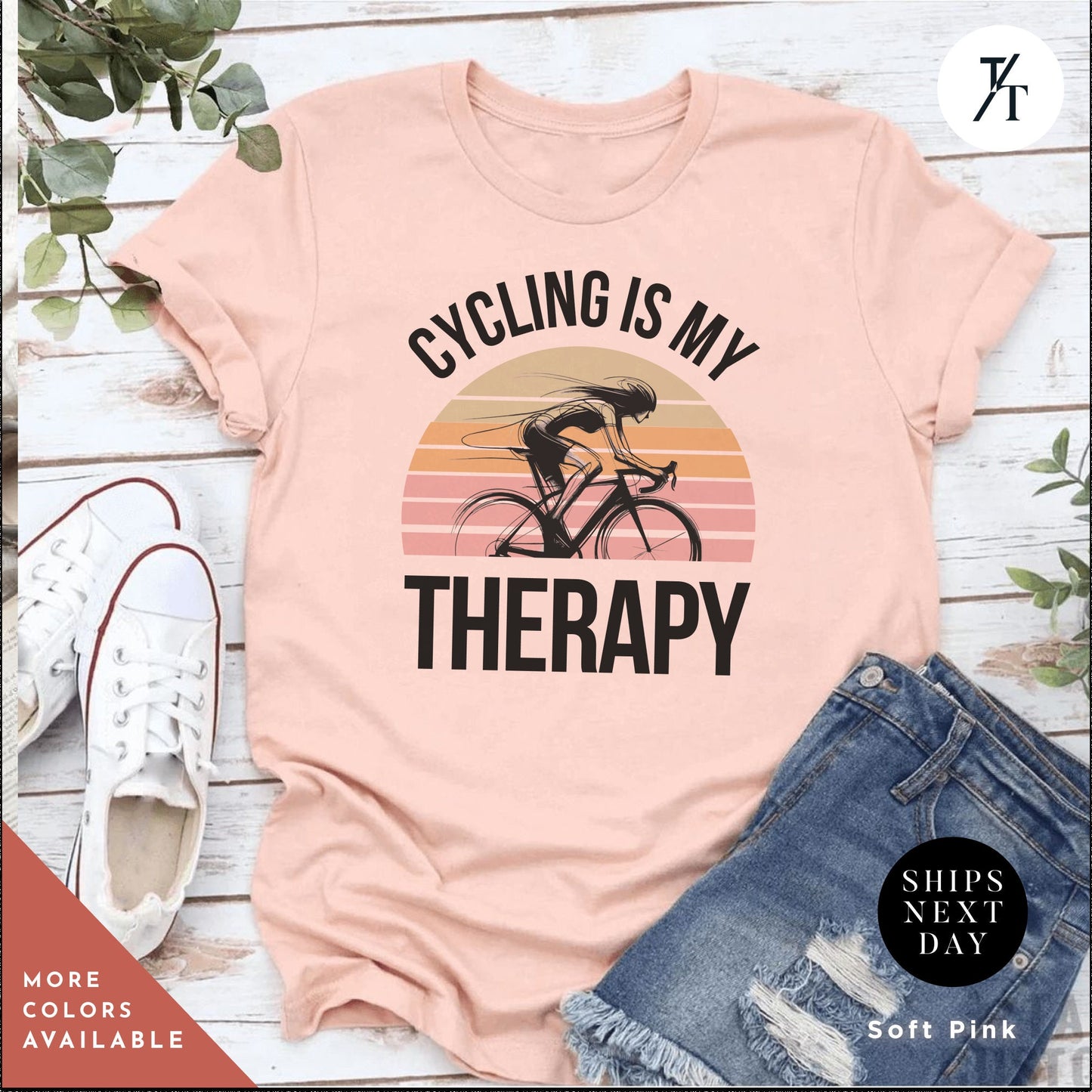 a pink shirt that says cycling is my therapy