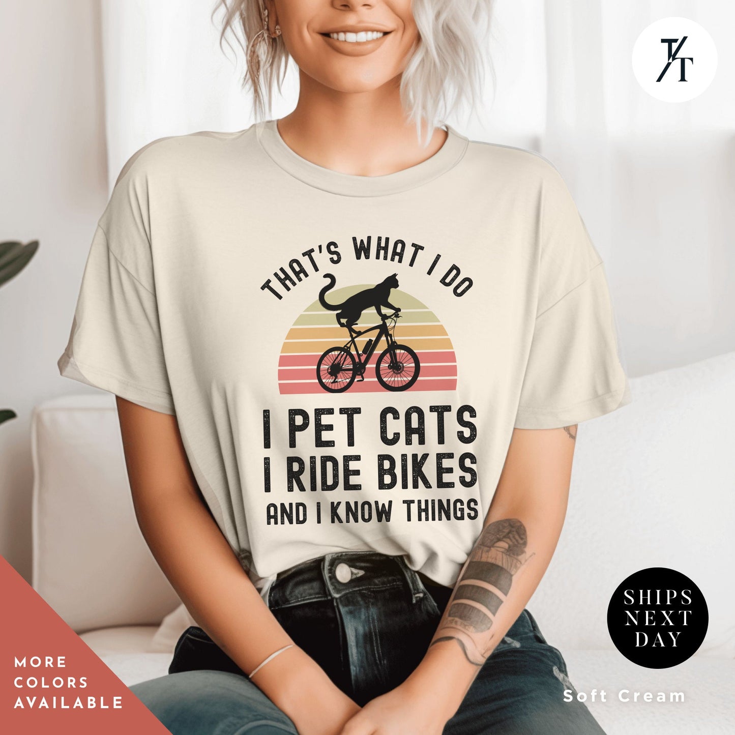 a woman sitting on a couch wearing a shirt that says, that's what