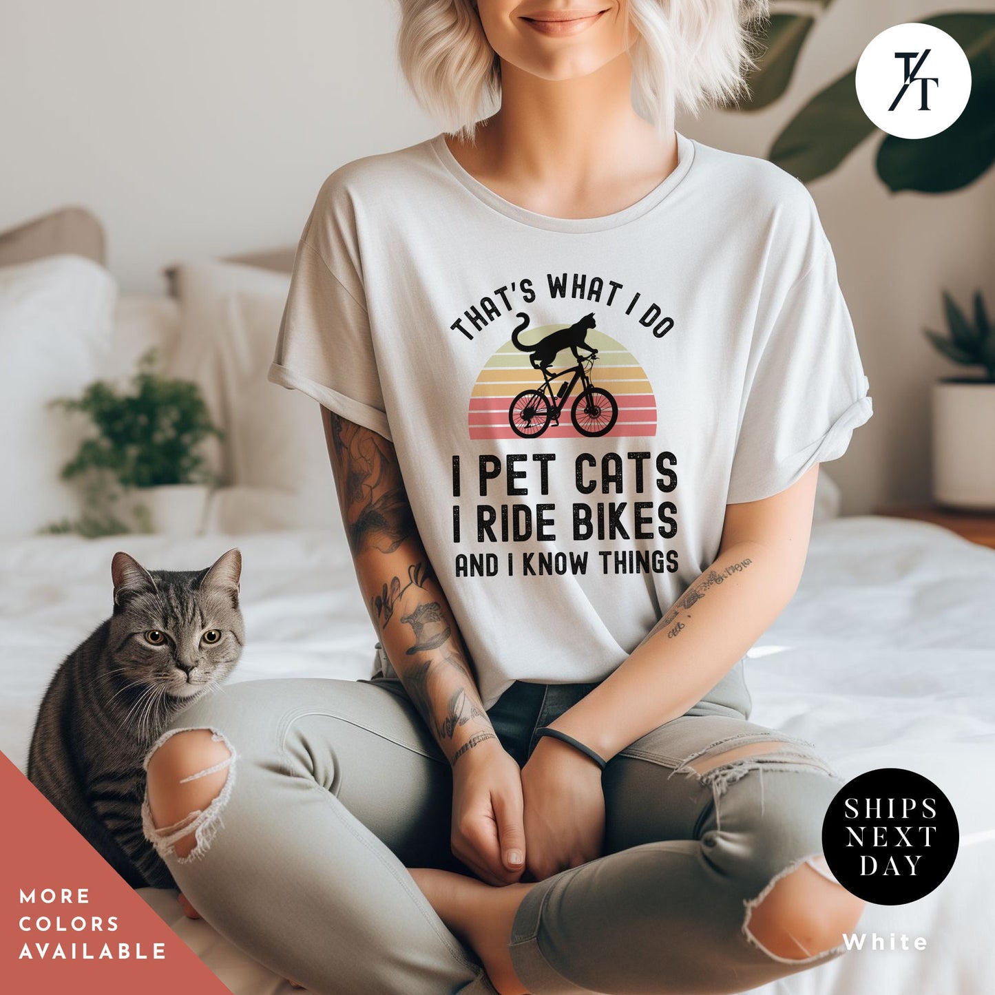 a woman sitting on a bed with a cat next to her