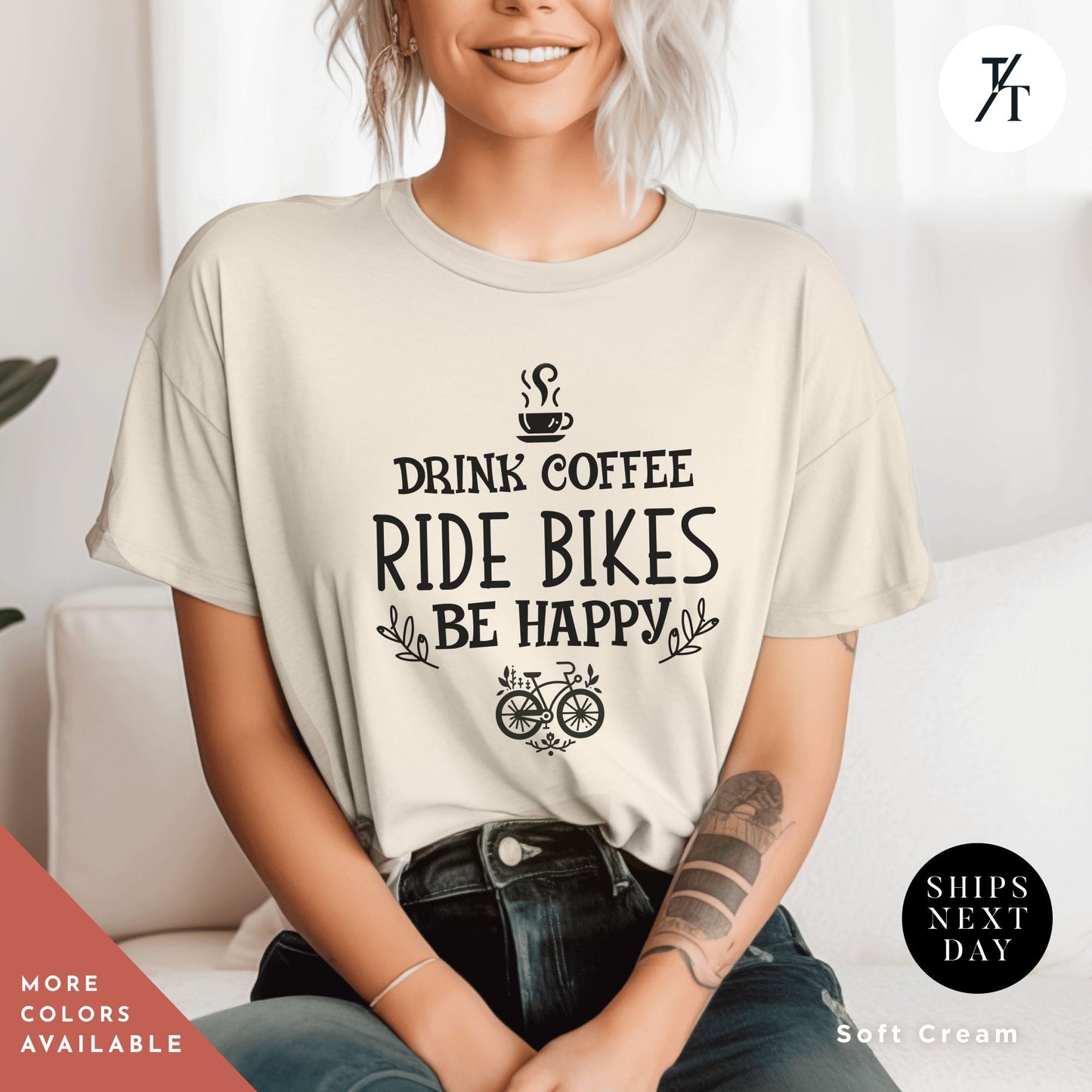a woman sitting on a couch wearing a coffee shirt