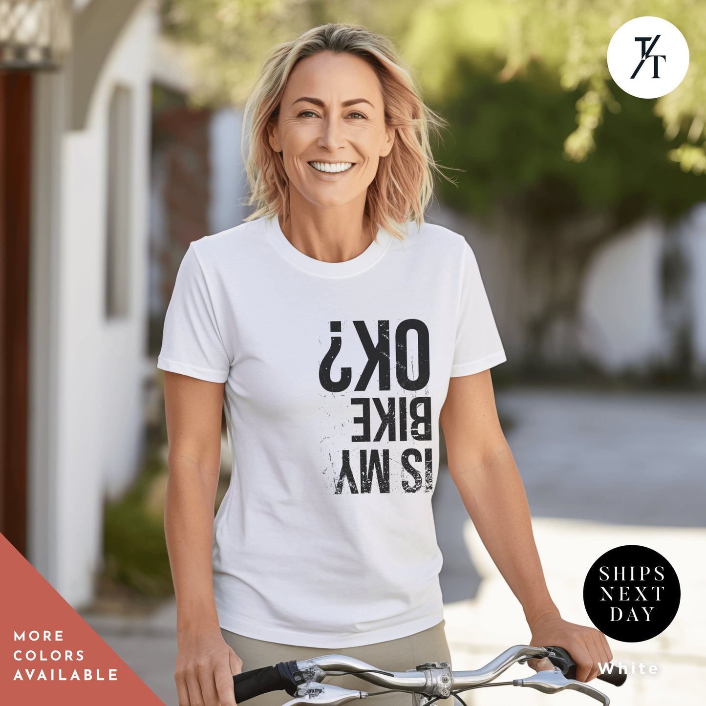 a woman riding a bike wearing a white shirt