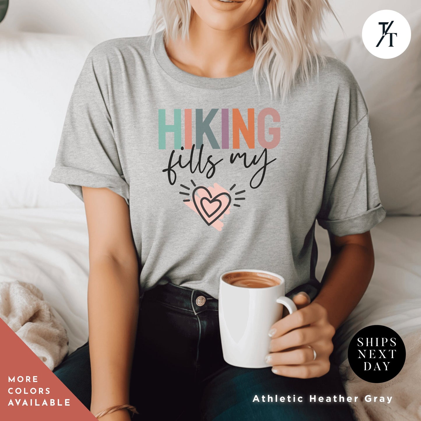 a woman sitting on a bed holding a cup of coffee