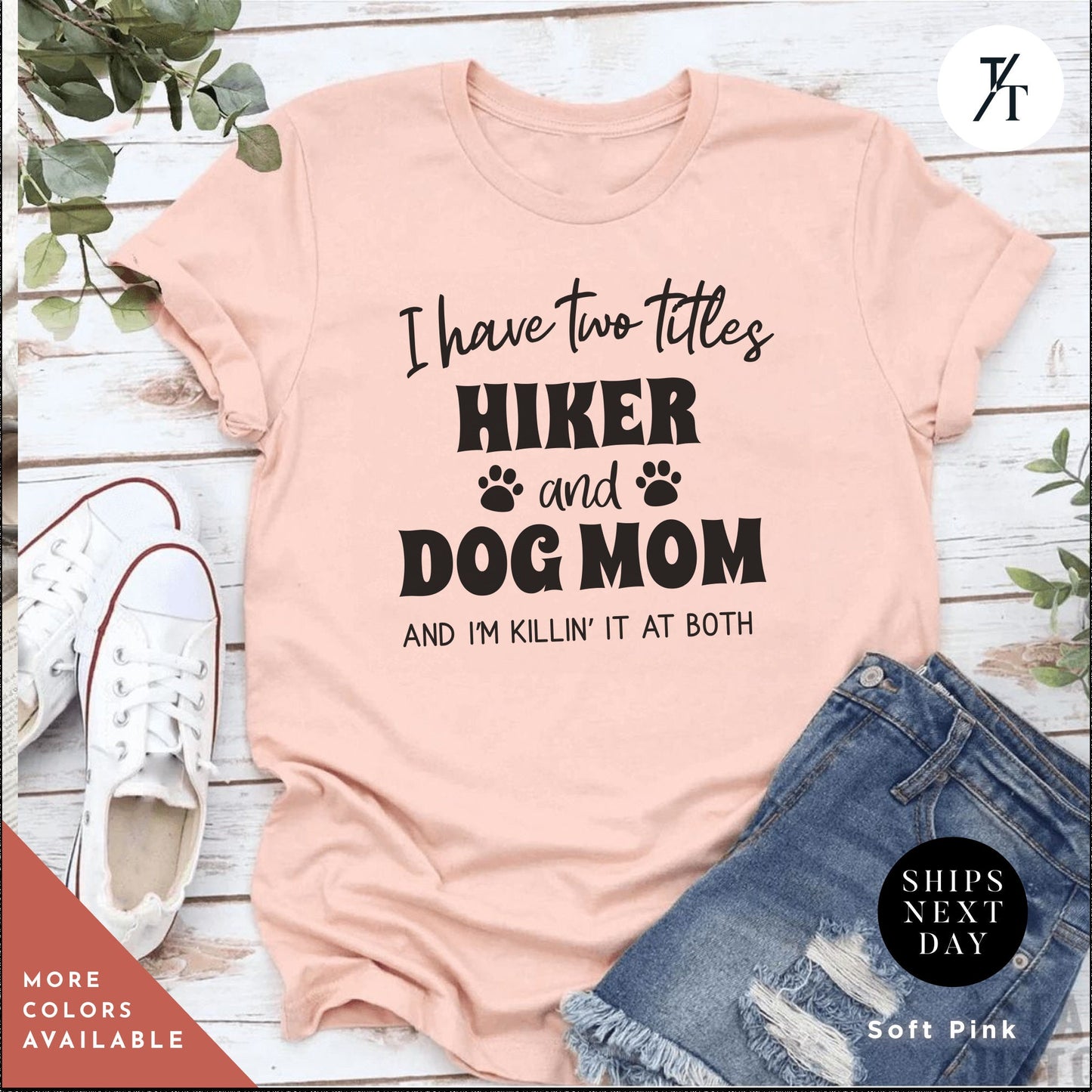 a pink shirt that says i have two titles hike and dog mom and i '