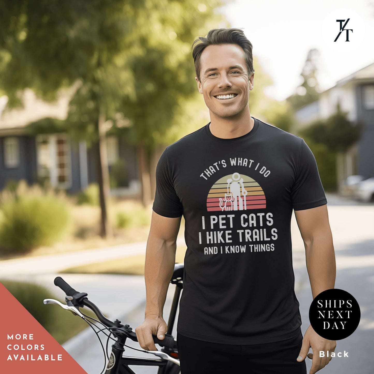 a man standing next to a bike wearing a black shirt