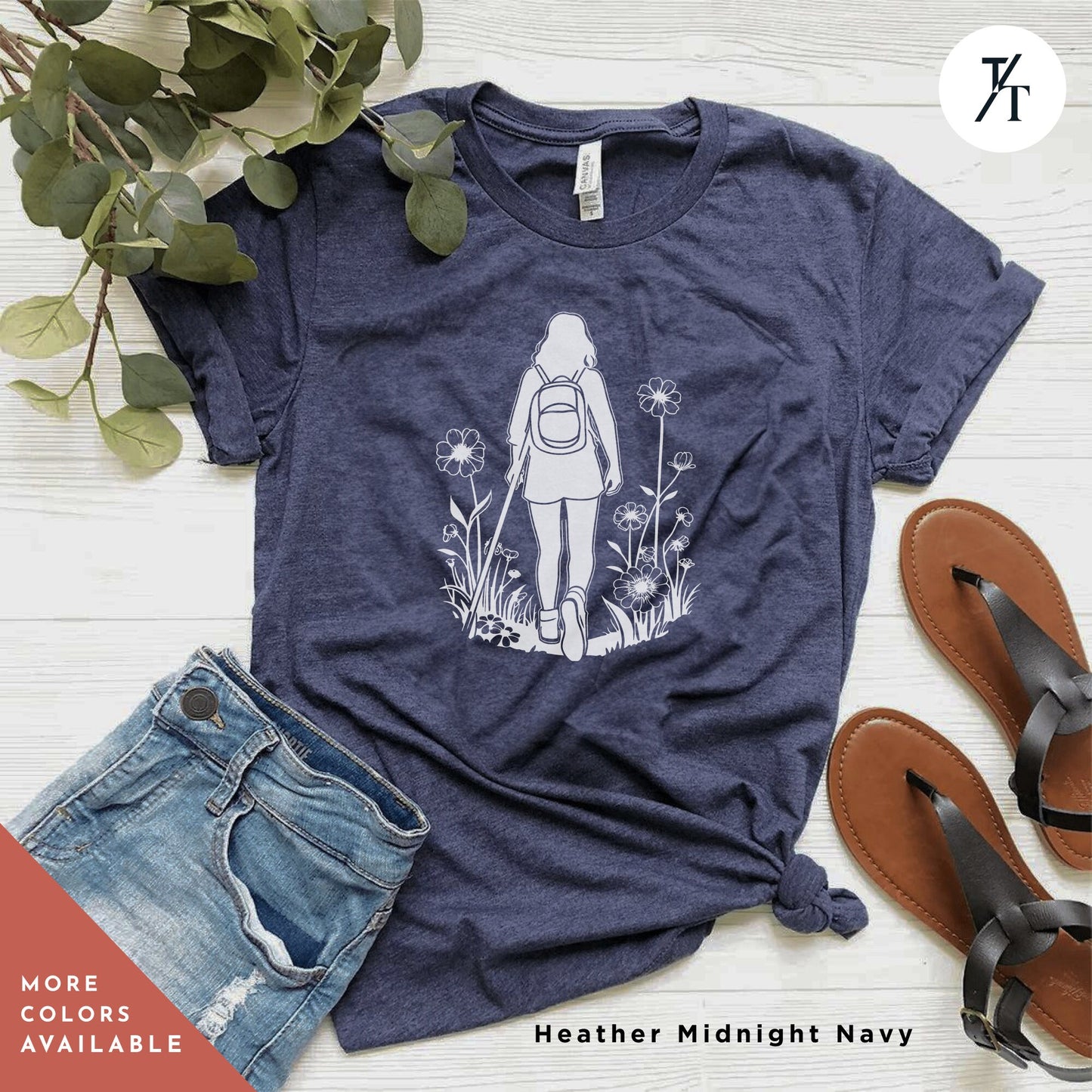 a women's t - shirt with a graphic of a girl with a backpack