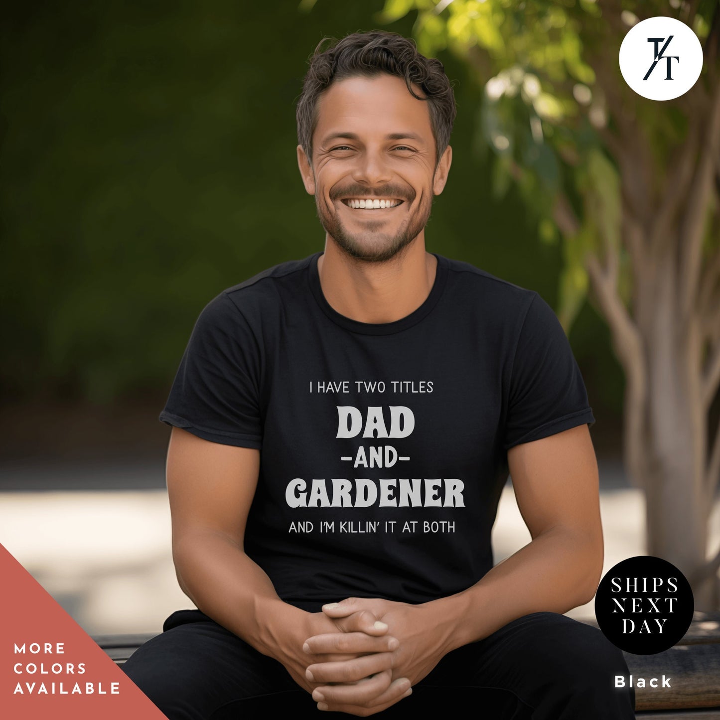 a man sitting on a bench wearing a t - shirt
