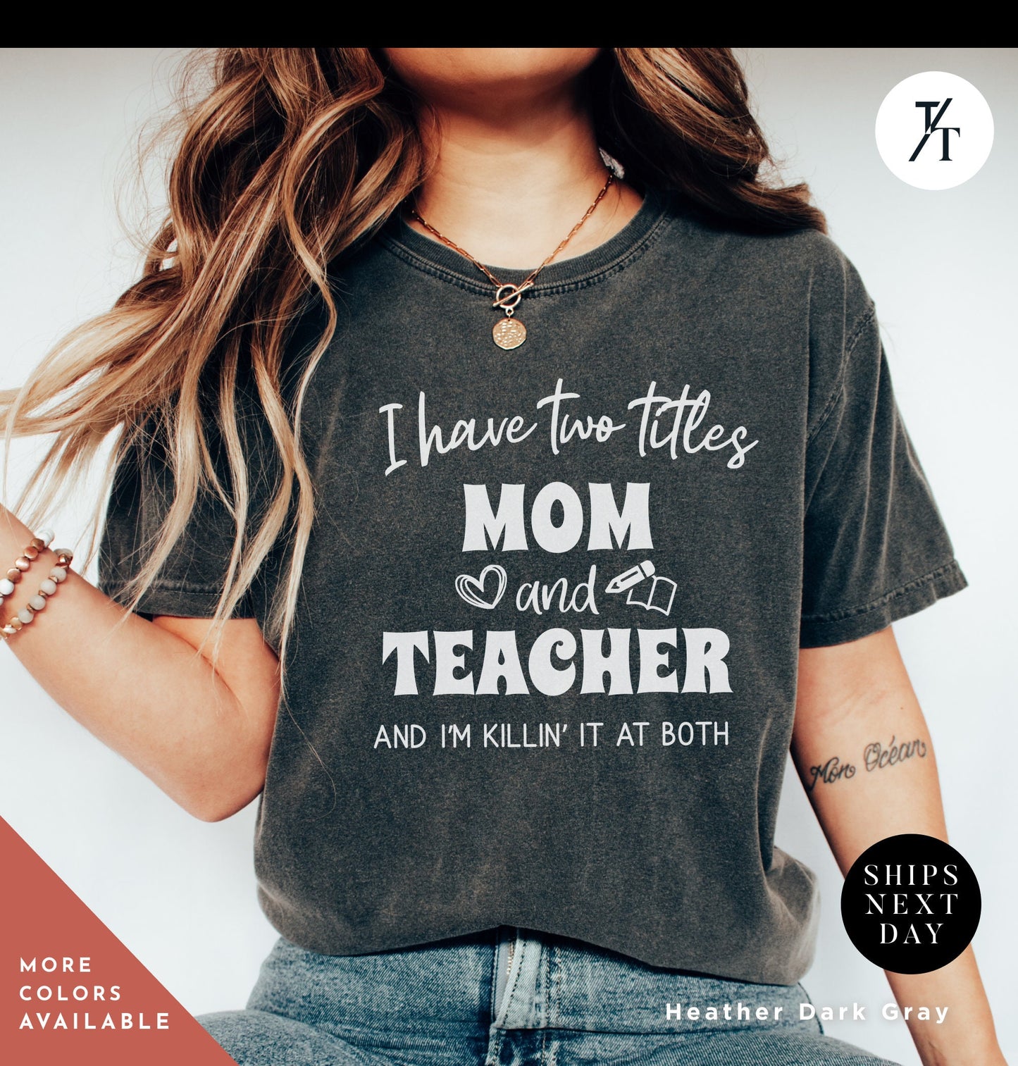a woman wearing a t - shirt that says i have two titles, mom and