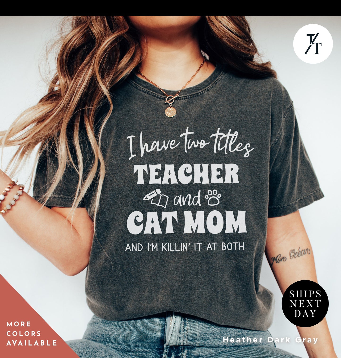 a woman wearing a t - shirt that says i have two titles teacher and cat