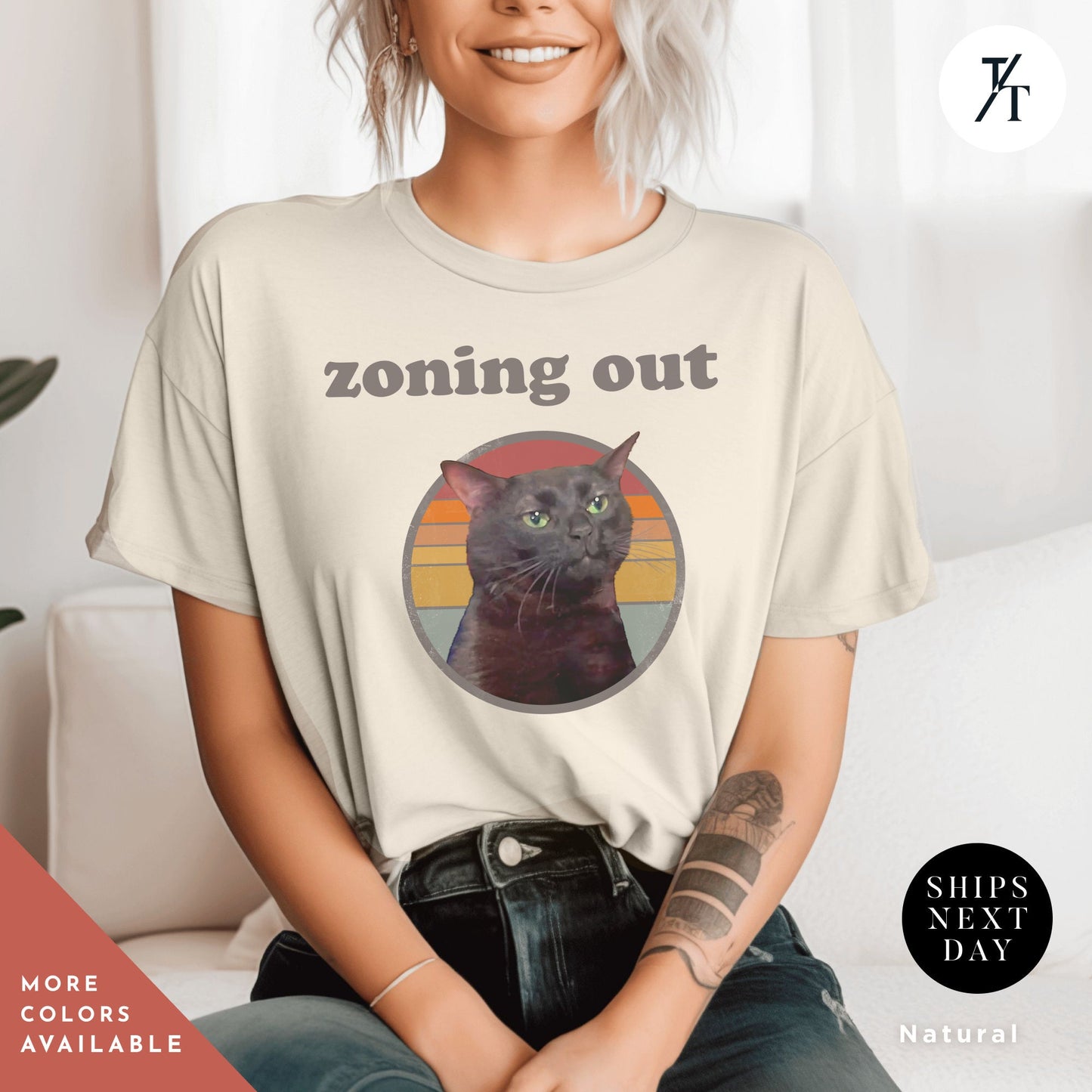 a woman sitting on a couch wearing a t - shirt with a picture of a black cat, , Zoning out shirt black cat Zoning Out Cat Meme tee, Disassociating Black Cat Funny Instagram and Tiktok Trend Meme Shirt, Dissociated Emote