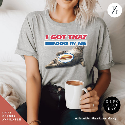 a woman sitting on a bed holding a cup of coffee, i got that dog in me cat, Funny Cat Shirt, Kirkland Signature tee, All Beef Hot Dog, Funny Costco Shirt, Gift For Him, Costco Hotdog tee