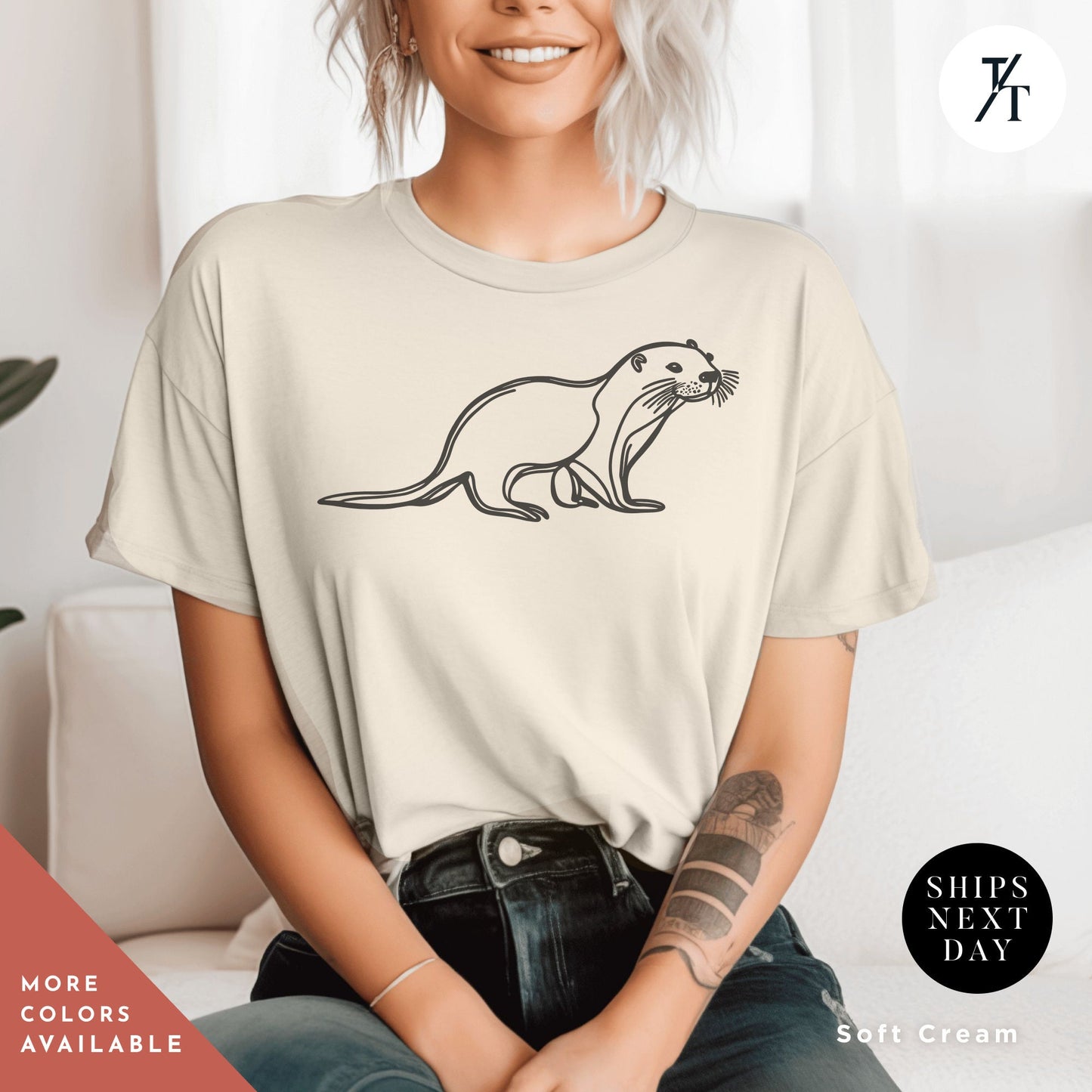 a woman sitting on a couch wearing a t - shirt with an image of a otter, , Otter Lover Shirt, One Line Art Shirt, Sea Otter Gifts, Line Drawing Shirts, Otters TShirt, Gift For Her, Sea Otters Tshirt, Cute Animal tee