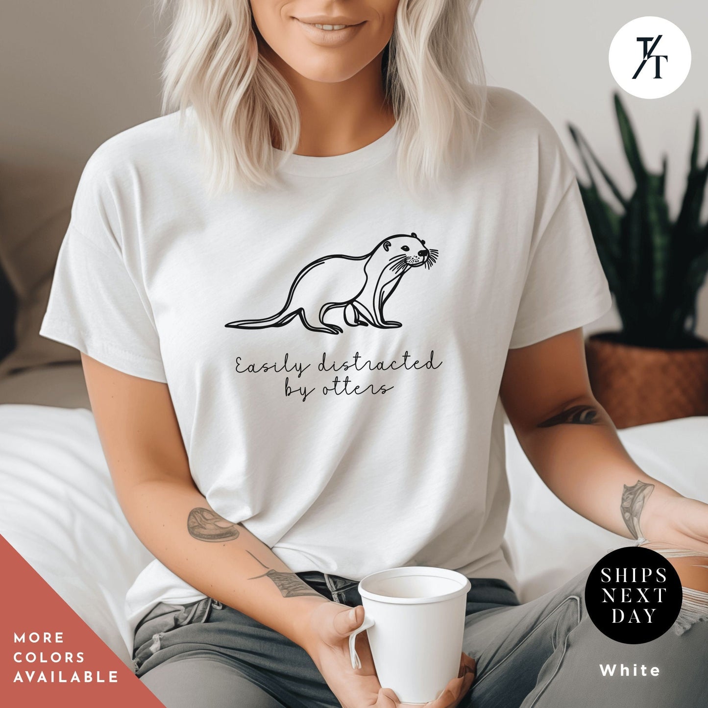 a woman sitting on a bed holding a cup of coffee, Easily distracted by otters, Funny Otter Shirt, Otter Lover Shirt, Sea Otters Gifts, Animal Lover Shirts, Cute Animal tee, Animal Lover Gift