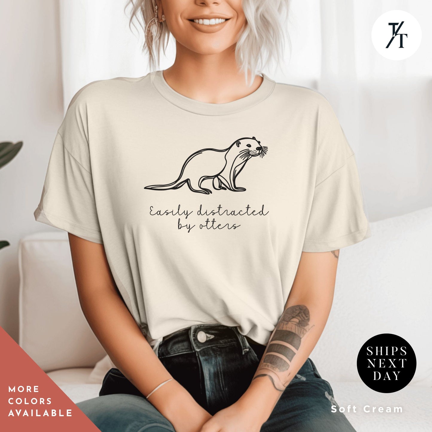 a woman sitting on a wearing a t-shirt with an otter on it. Easily distracted by otters, Funny Otter Shirt, Otter Lover Shirt, Sea Otters Gifts, Animal Lover Shirts, Cute Animal tee, Animal Lover Gift
