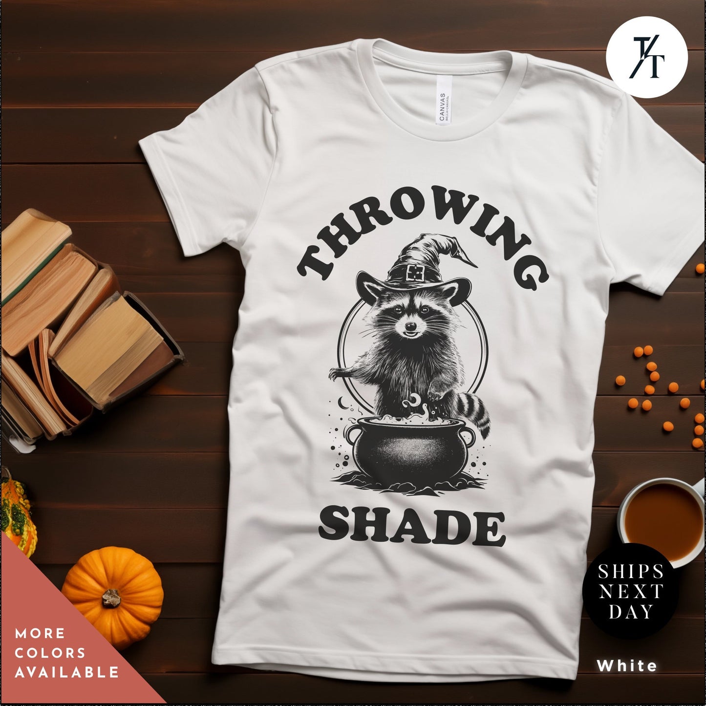a white t - shirt with a raccoon wearing a hat, Funny halloween Raccoon shirt, Halloween Gifts, Cute Retro Raccoon Tee, Meme Lover, Throwing Shade Tee, Be A Witch tee, Groovy Graphic Tees