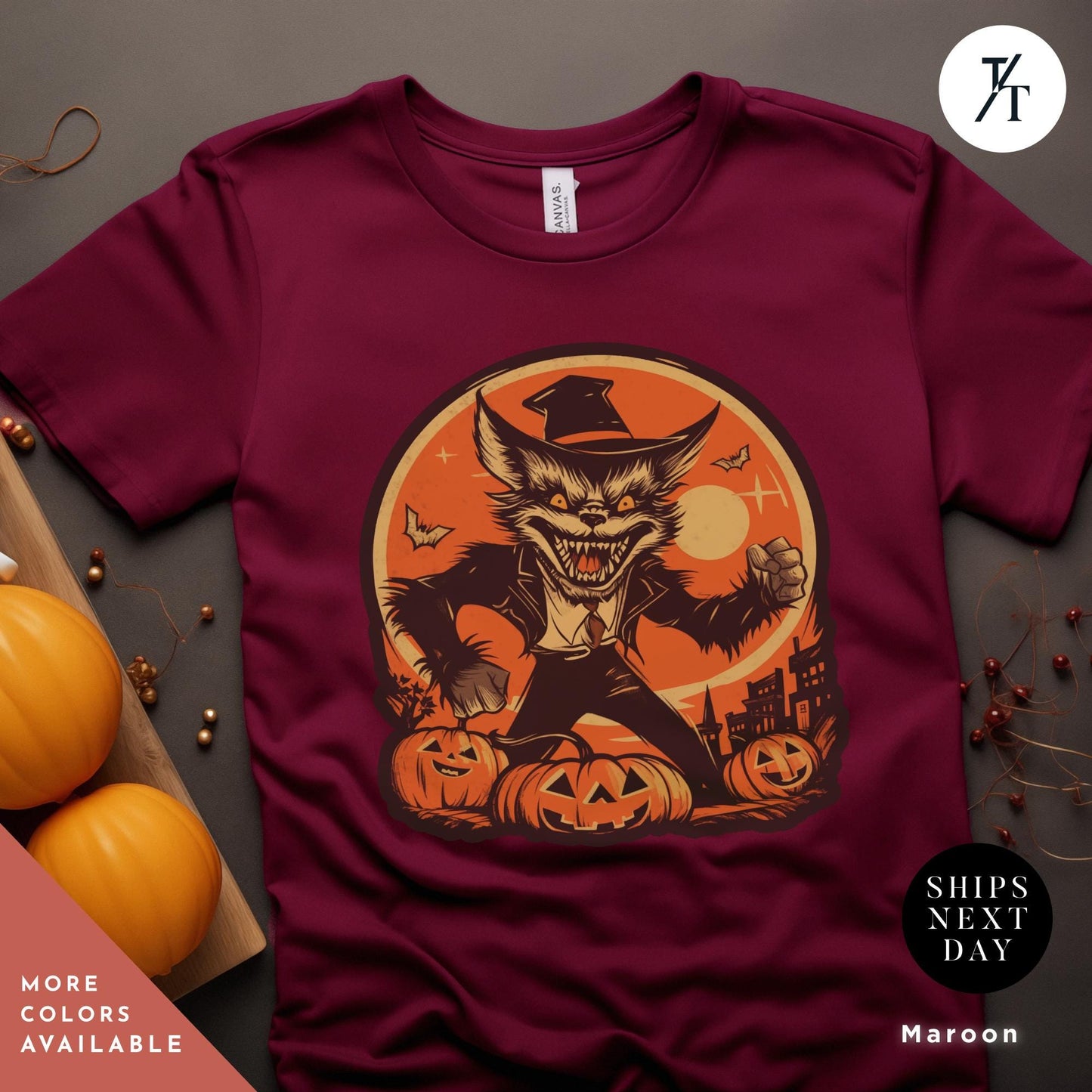 a t - shirt with an image of a cat wearing a hat and holding a