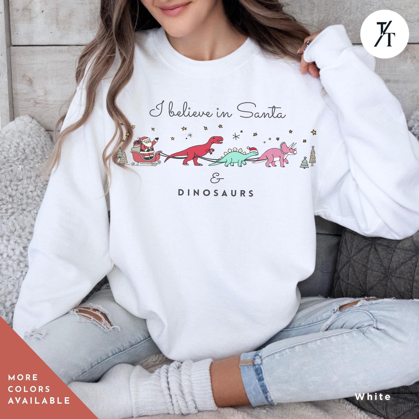 a woman wearing a white sweatshirt that says believe in santa and dinosaurs, I believe in santa and dinosaurs sweatshirt, Christmas Sweatshirt, I Believe In Santa Dinosaurs Sweatshirts, Christmas Gifts Holiday Sweater