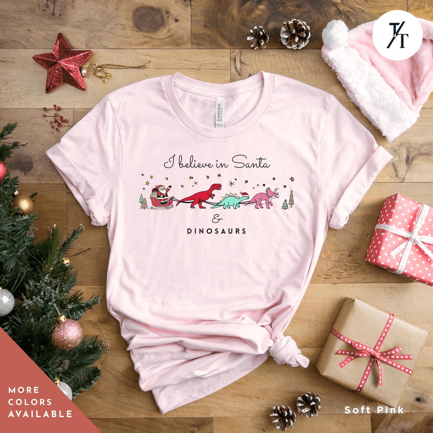 a pink t - shirt that says i believe in santa dinosaurs,I believe in santa and dinosaurs shirt, Santa And Dinosaurs, Christmas Dinosaur, Cute Christmas Shirt, Dinosaur Sweatshirt, Funny Xmas Shirt