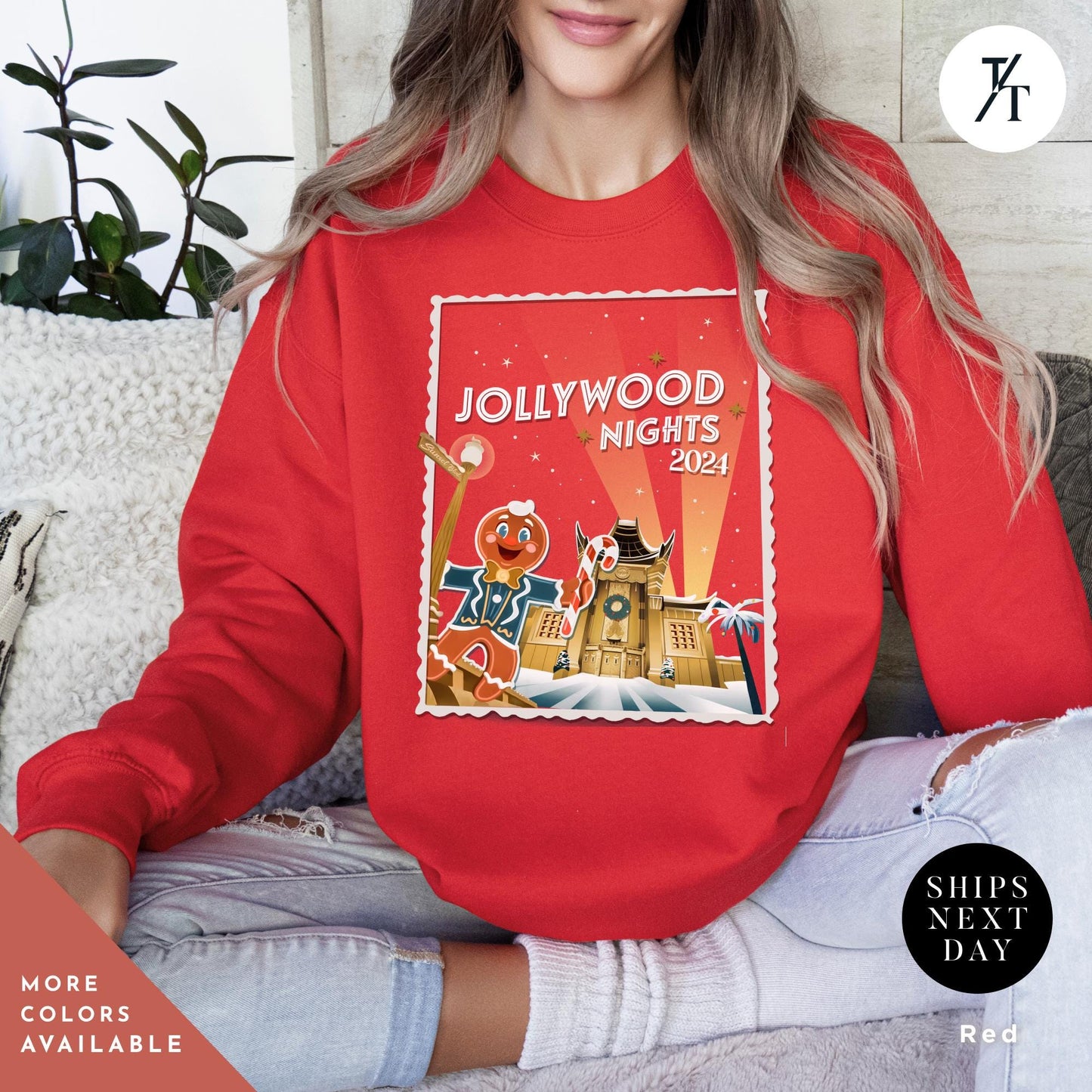 a woman sitting on a couch wearing a red sweatshirt, Hollywood nights 2024 Christmas Sweatshirt, Hollywood Studios Christmas Shirt, Jollywood Nights Tee, Sweatshirt Hoodie, Family Matching Tee