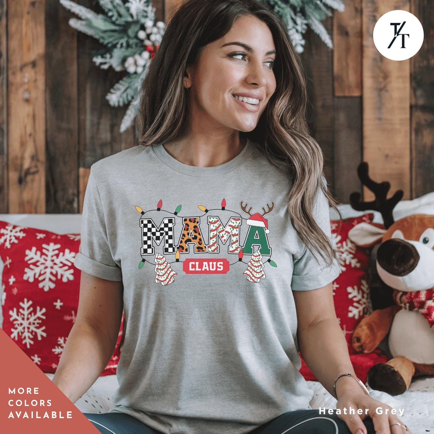 a woman sitting on a bed wearing a t - shirt that says mama claus, Mama Varsity Christmas Tree Cake Mama Claus Christmas Varsity Shirt, Mama Christmas shirt, Retro Xmas Leopard Coquette Gift For Mom tee